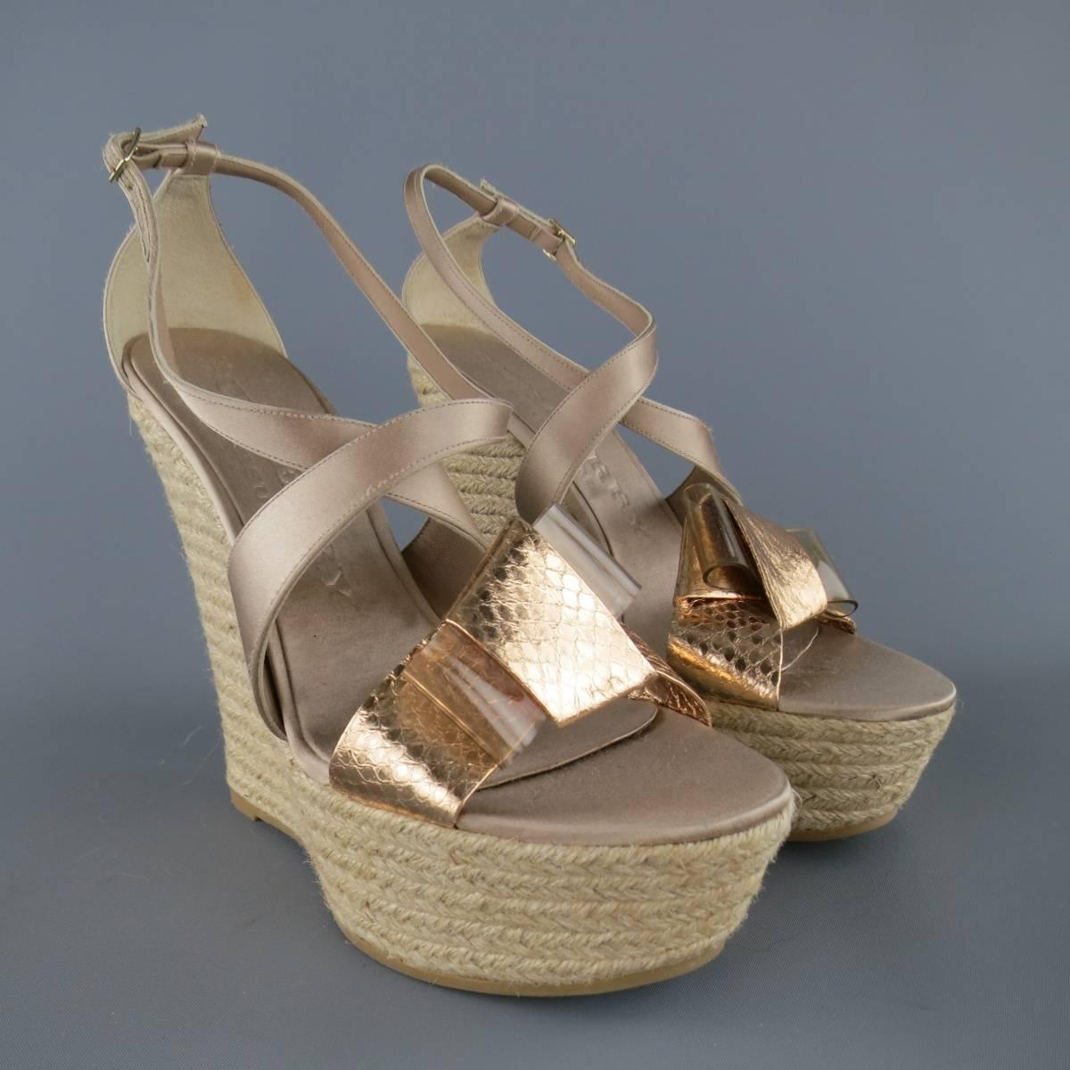 BURBERRY PRORSUM runway shoes feature a peachy beige silk satin X strap front, metallic rose gold snakeskin toe strap with clear PVC detailed bow, and platform espadrille wedge sole. Never worn. Made in Italy.
 
New Pre-Owned Condition.
Marked: IT