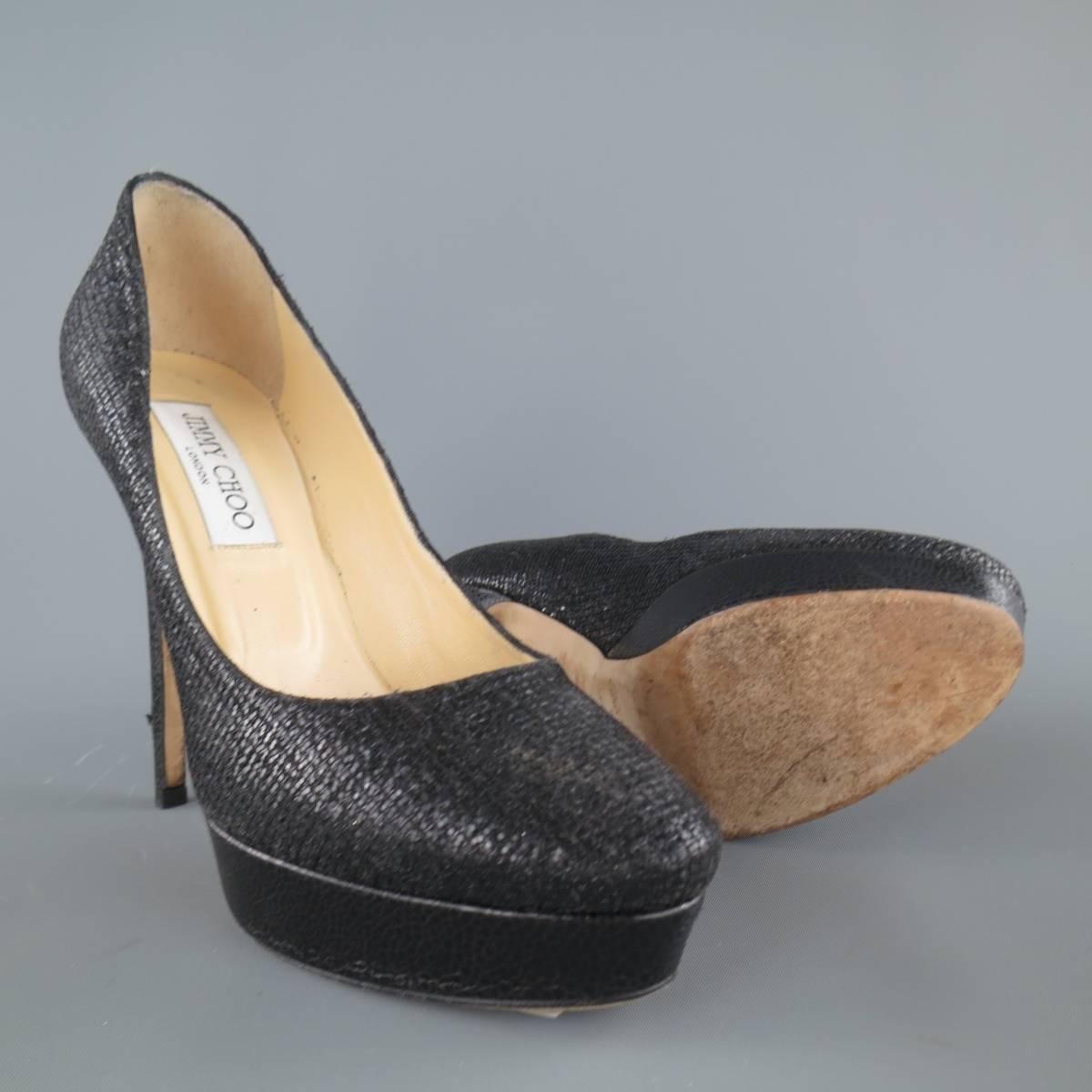JIMMY CHOO pumps come in black glitter encrusted leather with a mesh overlay and feature a round pointed toe with metallic, crackle textured leather covered platform and covered stiletto heel. Made in Italy.
 
Good Pre-Owned Condition.
Marked: IT