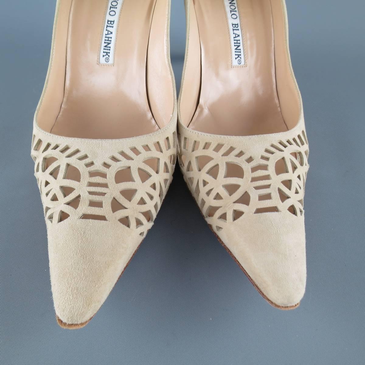 MANOLO BLAHNIK pumps come in beige suede and feature a pointed toe with cutout pattern detail and covered stiletto heel Wear throughout. Made in Italy.
 
Good Pre-Owned Condition.
Marked: IT 37.5
 
Heel: 3.25 in.


Web ID: 83244 