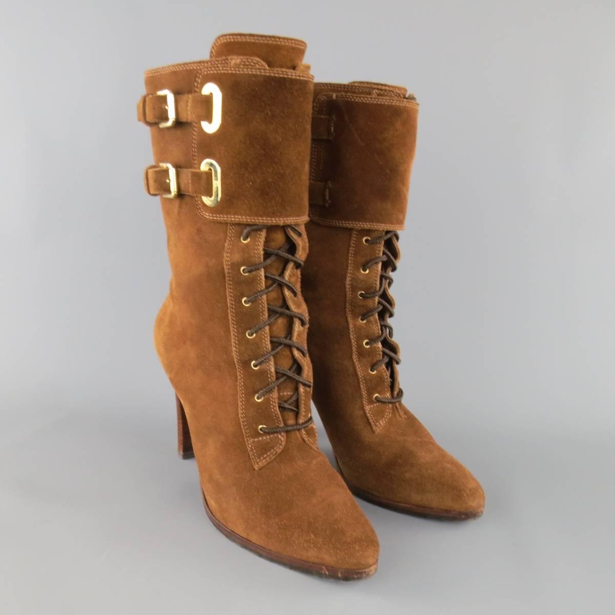 RALPH LAUREN COLLECTION boots come in rich brown suede and feature a pointed toe, lace up front with hooks, thick ankle strap with double gold tone buckle hardware, and stacked high heel.
 
Excellent Pre-Owned Condition.
Marked: 7.5 B
 
Heel: 4