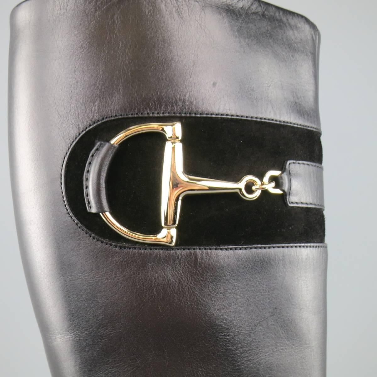 GUCCI vintage inspired knee high boots come in smooth black leather and feature a square toe, thick stacked heel, internal side zip, and suede detail with light gold tone  horsebit hardware. With Box. Made in Italy.
 
Excellent Pre-Owned