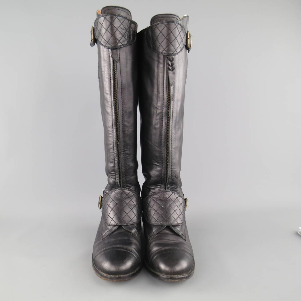 Vintage CHANEL riding boots come in smooth black leather and feature a round cap toe, quilted heel, tall zip front shaft with embroidered CC logo sides, and thick quilted straps with dark gold tone engraved buckles. Made in Italy.
 
Good Pre-Owned