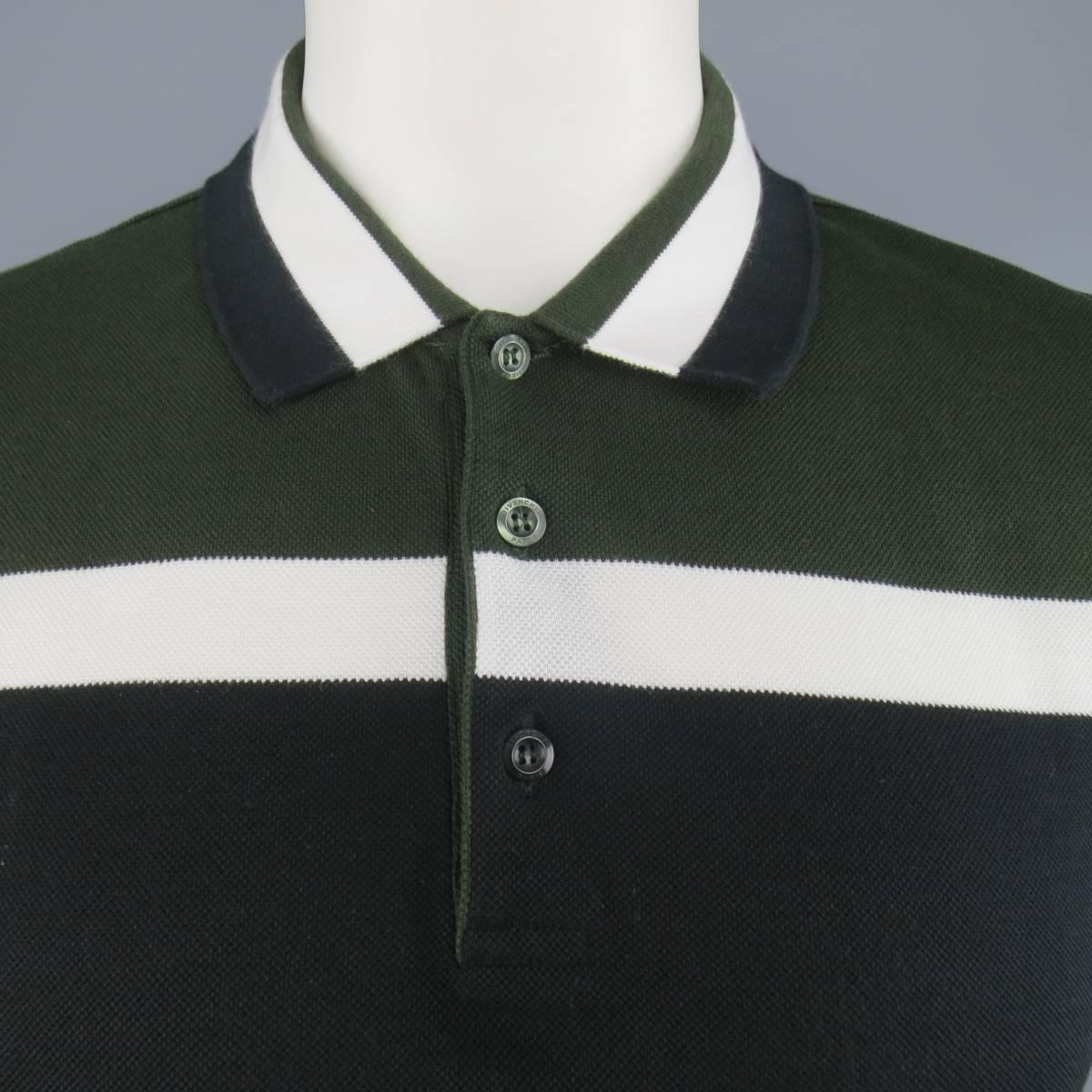 GIVENCHY by Riccardo Tisci polo comes in classic cotton pique with dark olive green, white and black stripe panel pattern and signature T cross stitch back. Made in Italy.
 
Excellent Pre-Owned Condition.
Marked: XL
Measurements:
 
Shoulder: 19