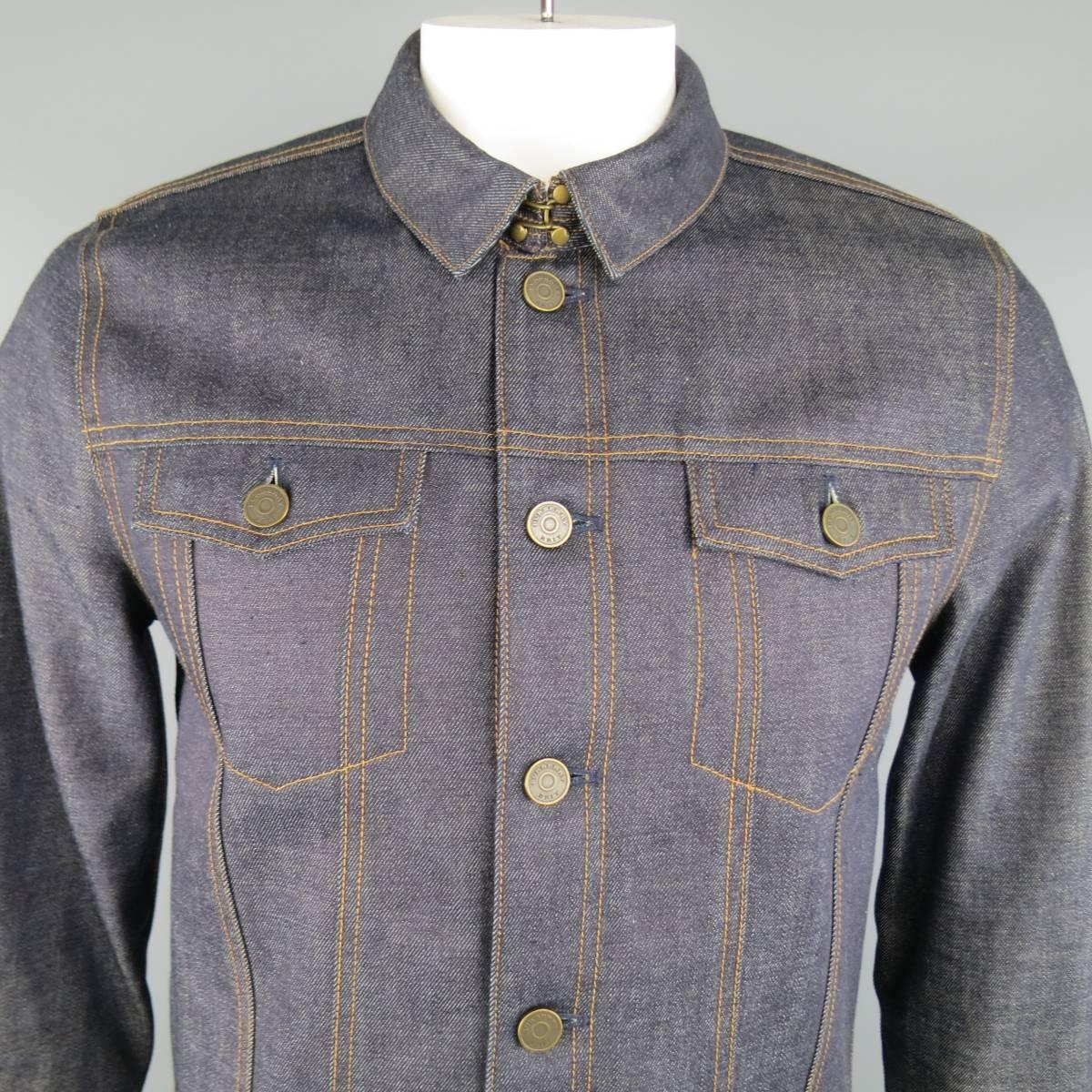 BURBERRY BRIT classic slim fit trucker jacket in indigo blue raw selvedge denim featuring a pointed collar, with hook eye closure and signature plaid flannel liner. Includes hanger and dust bag.
 
New without Tags.
Marked: L
 
Measurements:
