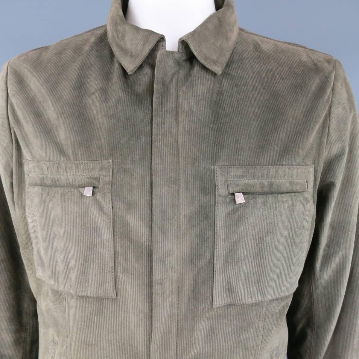 LUCIANO BARBERA jacket comes in moss green corduroy textured suede and features a pointed collar, hidden placket zip front, double sip patch pockets, and slanted slit pockets. Made in Italy.
 
Good Pre-Owned Condition.
Marked: IT 54
 
Measurements:
