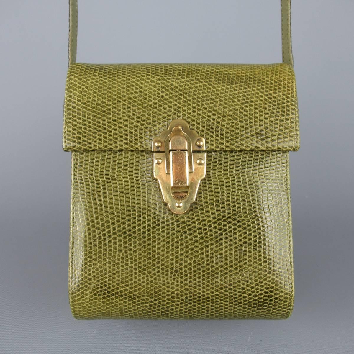 Vintage WILKES BASHFORD mini shoulder bag comes in green snakeskin leather an features a structured box with gold tone lock closure with a skinny crossbody strap. Carry as a clutch or wear with strap. Wear throughout. As-Is. Made in Italy.
 
Good