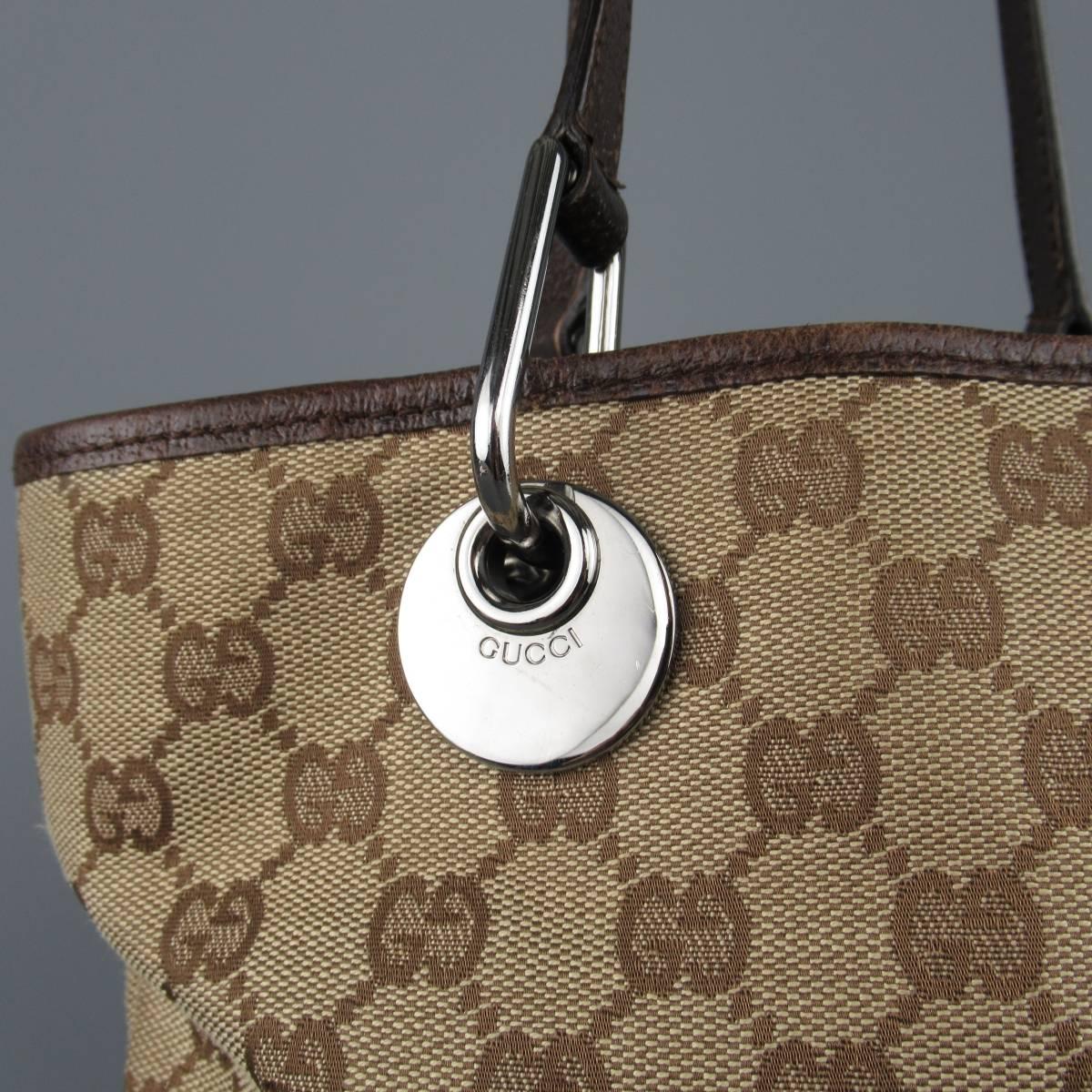 Classic GUCCI mini tote comes in beige and brown Guccissima monogram canvas and features brown leather piping and top handles with dark silver tone engraved hardware. Wear on corners. As-Is. Made in Italy.
 
Fair Pre-Owned Condition.
