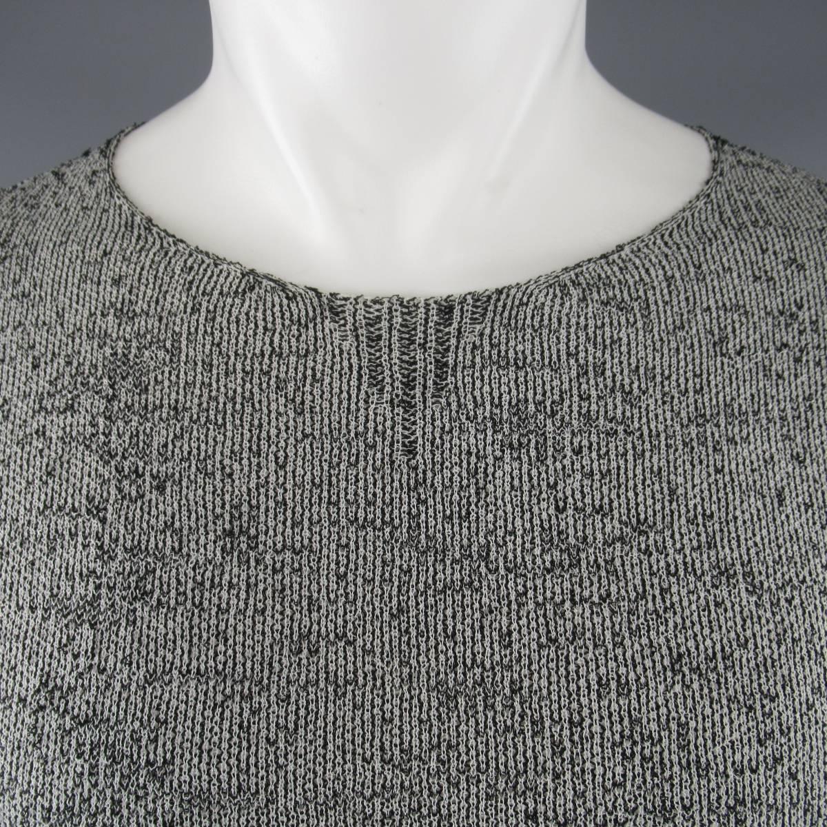 RAF SIMONS Spring/Summer 2009 Collection pullover sweater comes in a light weight,  textured black and white high contrast viscose blend knit with a crewneck, extended length, and ribbed hem. Runs very slim. Made in Belgium.
 
Excellent Pre-Owned