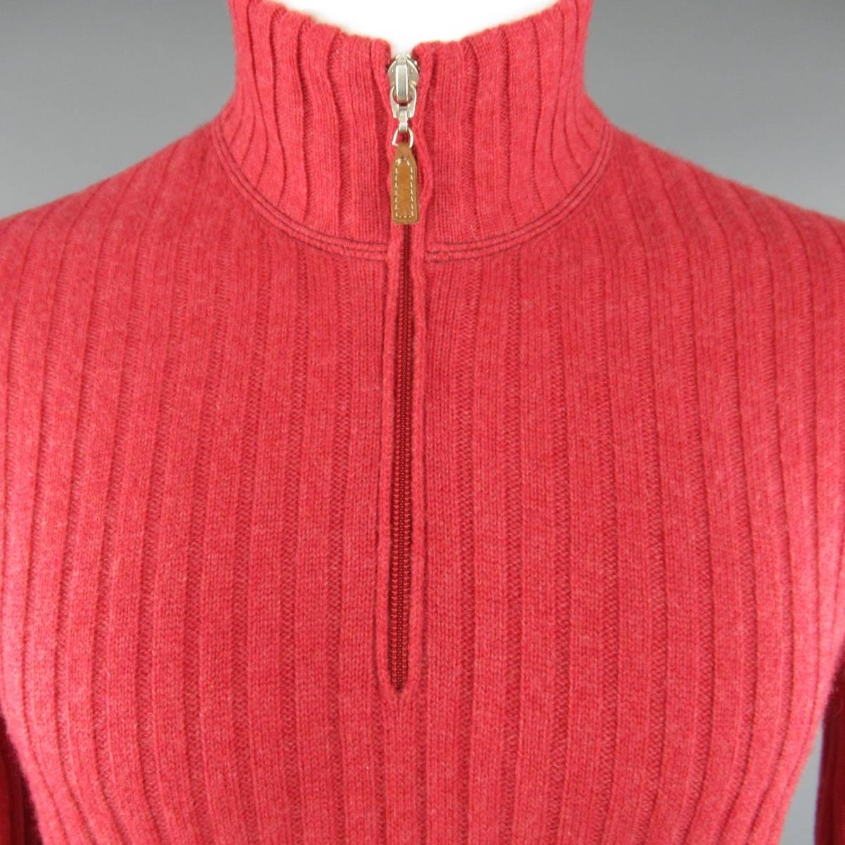 BRUNELLO CUCINELLI Pullover consists of cashmere material in a red color tone. Designed in a high-collar, half zip-up chest with leather tab. Stripe knit textured pattern, raglan shoulder detail with rib cuff and hem. Made in Italy.
 
Excellent