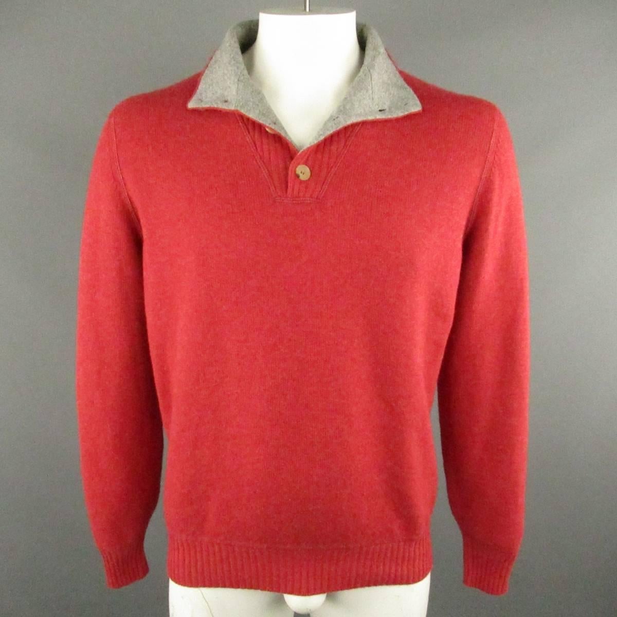 BRUNELLO CUCINELLI Sweater consists of cashmere material in a red color tone. Designed in a high-collar, button-up chest in rib pattern. Raglan shoulder detail with rib cuff and hem. Made in Italy.
 
Good Pre-Owned Condition 
Marked Size: 52

