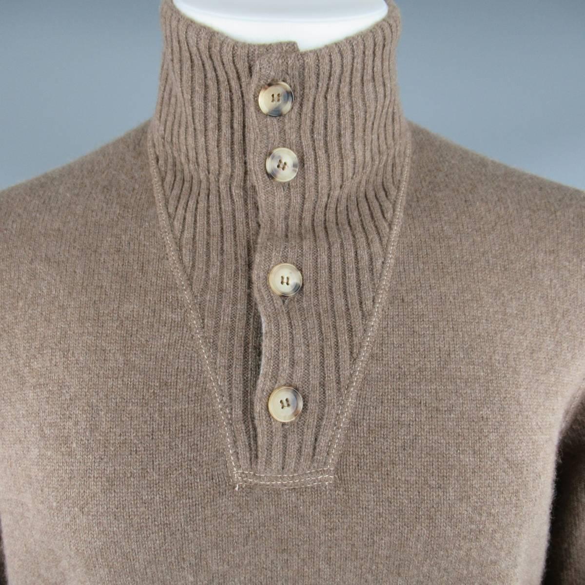 BRUNELLO CUCINELLI Sweater consists of cashmere blend material in a brown color tone. Designed in a high-collar, button-up chest in a rib pattern. Raglan shoulder detail with rib cuff and hem. Contrast white stitching.  Made in Italy.
 
Good
