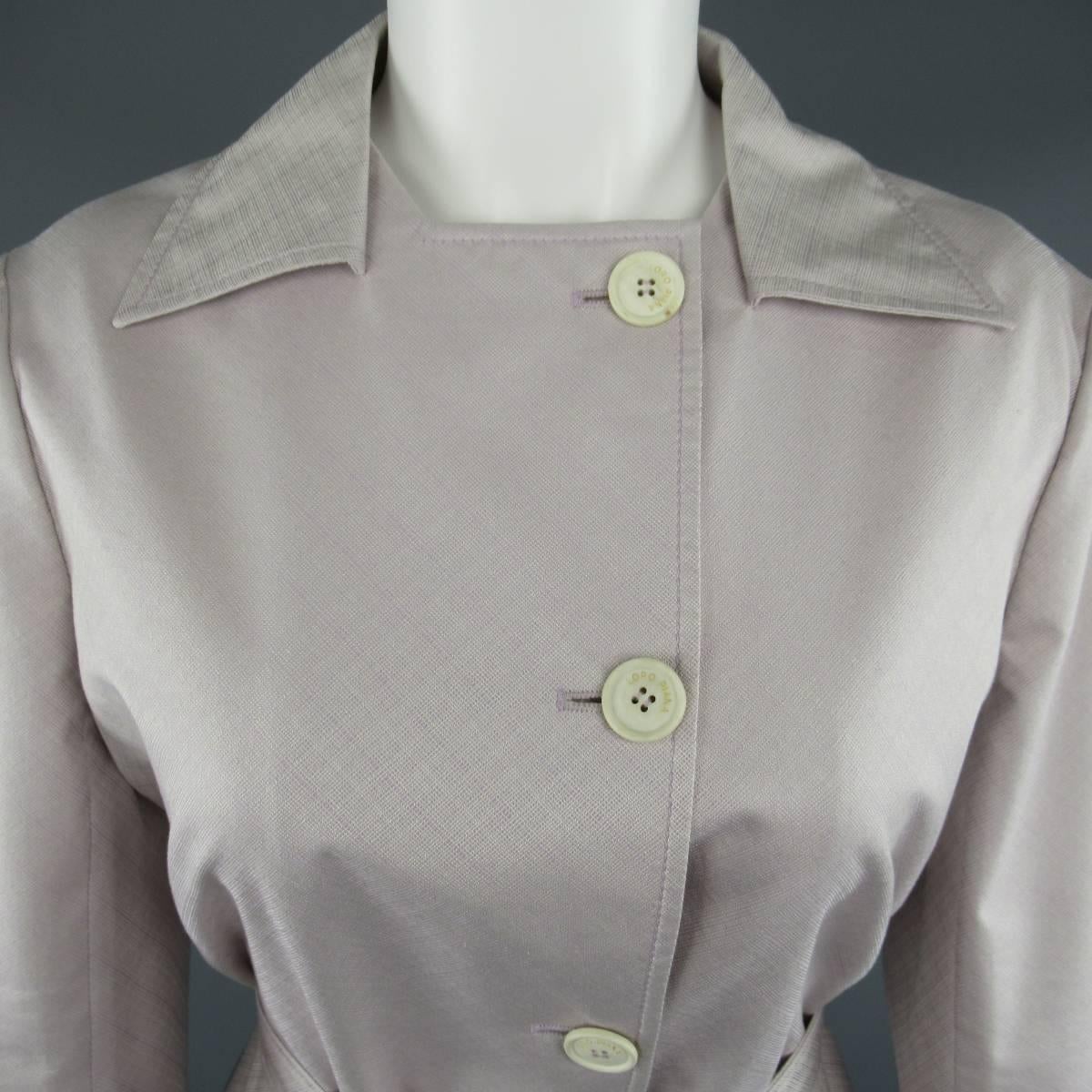 LORO PIANA light weight trench coat comes in a light lavender lilac pink textured cotton silk blend fabric and features a pointed collar, single breasted button up front, epaulet cuff sleeves, and belted tie waist.  Made in Italy.

Excellent