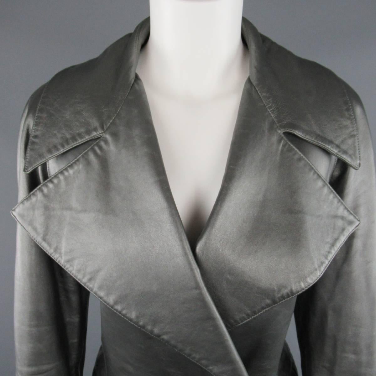 Vintage 1990's RALPH LAUREN COLLECTION jacket comes in a metallic smoke silver soft leather and features an oversized pointed collar lapel, double breasted button closure, flap pockets, and raglan sleeves. Minor wear throughout. Made in USA.

Fair