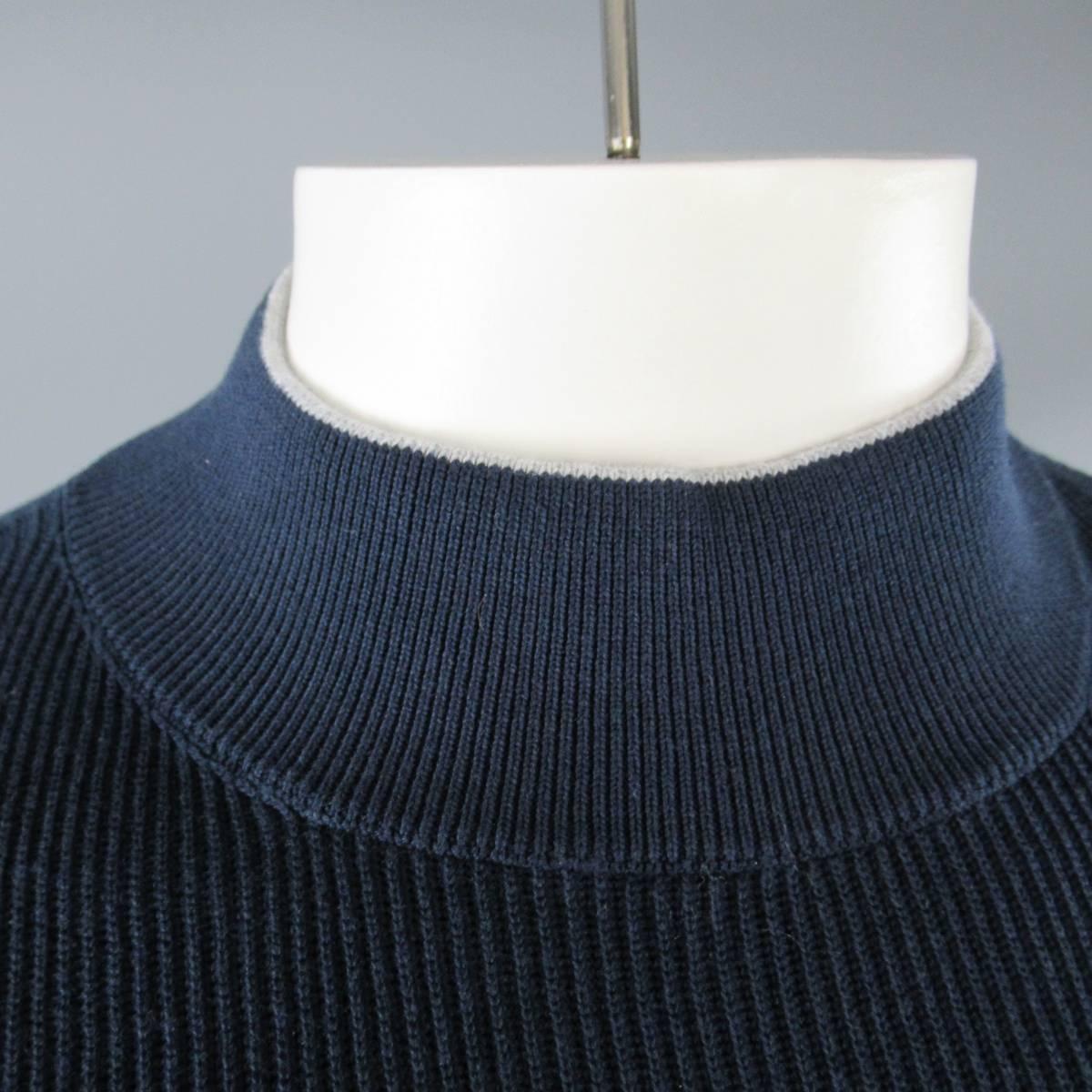 BRUNELLO CUCINELLI pullover sweater comes in navy blue ribbed cotton knit with a high mock neck, slit waist band and gray trim. Made in Italy.
 
New with Tags
Marked: 52
 
Measurements:
 
Shoulder: 17 in.
Chest: 44 in.
Sleeve: 27 in.
Length: 30