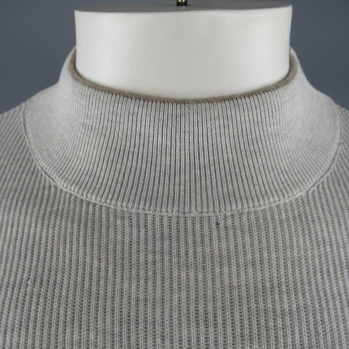 BRUNELLO CUCINELLI pullover sweater comes in light Heather gray ribbed cotton knit with a high mock neck, slit waist band and tan trim. Made in Italy.
 
Excellent Pre-Owned Condition.
Marked: 52
 
Measurements:
 
Shoulder: 17 in.
Chest: 44