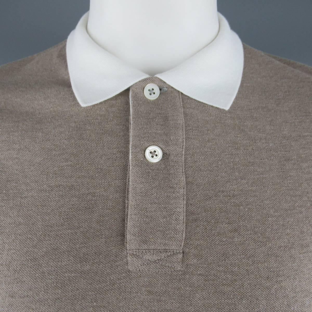 BRUNELLO CUCINELLI polo comes in heather taupe cotton pique with white contrast collar and arm bands. Made in Italy.
 
New with Tags.
Marked: XXL
 
Measurements:
 
Shoulder: 19.5 in.
Chest: 47 in.
Sleeve: 9.5 in.
Length: 30 in.

SKU: 84025