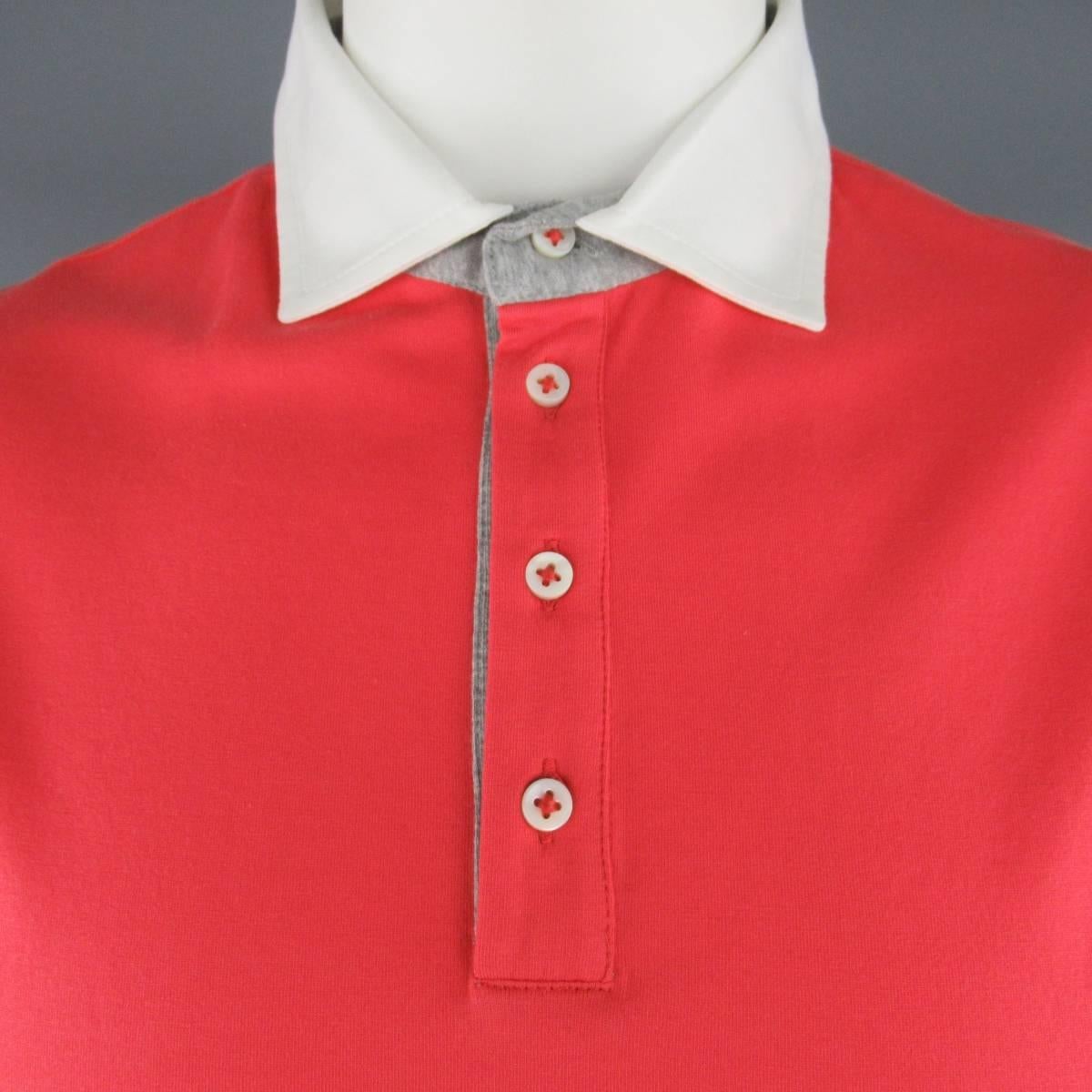 BRUNELLO CUCINELLI polo comes in a brilliant salmon coral red color cotton jersey featuring a white contrast collar with heather gray trim. Made in Italy.
 
New with Tags.
Marked: 54
 
Measurements:
 
Shoulder: 19 in.
Chest: 48 in.
Sleeve: 10