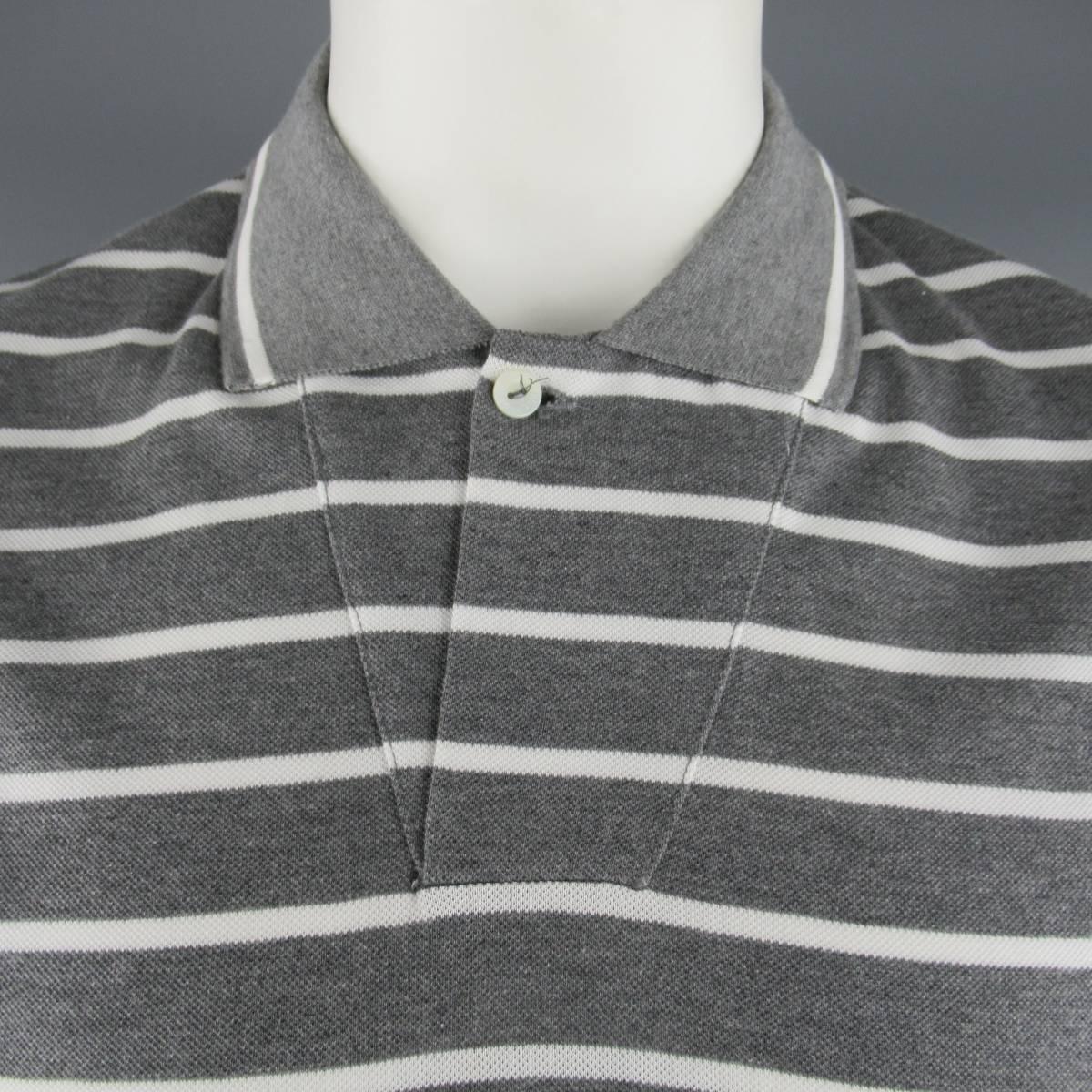 Classic LORO PIANA polo comes in dark heather gray & white stripe cotton pique with a diagonal seam single button closure. Made in Italy.
 
New with Tags.
Marked: XXL
 
Measurements:
 
Shoulder: 20 in.
Chest: 47 in.
Sleeve: 9 in.
Length: 29