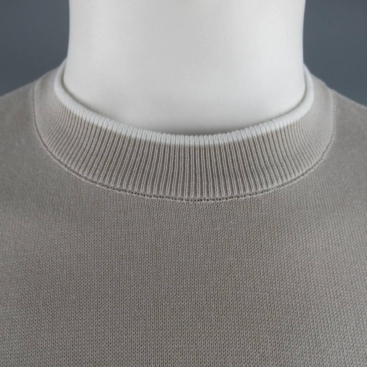 Classic BRIONI T-shirt comes in a beige cotton pique knit  with white accent striped collar and sleeves. Made in Italy.
 
New with Tags.
Marked: L
 
Measurements:
 
Shoulder: 19.5 in.
Chest: 46 in.
Sleeve: 10.5 in.
Length: 29 in.

SKU: 84042