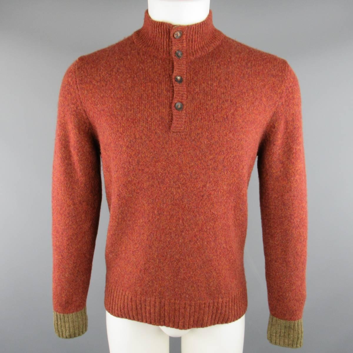 LORO PIANA pullover sweater comes in a brick red heather textured cashmere knit and features a high neck collar with half button closure, and moss green cuffs. Made in Italy.
 
Good Pre-Owned Condition.
Marked: IT 46
 
Measurements:
 
Shoulder: 17