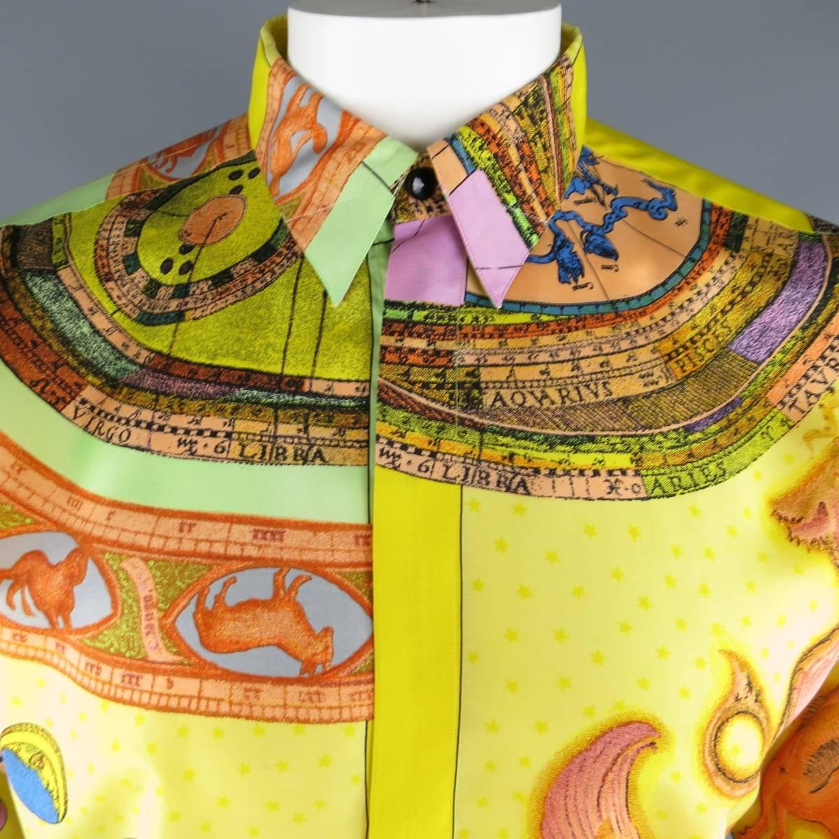 This rare vintage 1990's GIANNI VERSACE shirt comes in a yellow silk with all over multi-color zodiac print in an oversized, drop shoulder fit with a hidden placket button closure. Made in Italy.
 
Excellent Pre-Owned Condition.
Marked: IT 50

