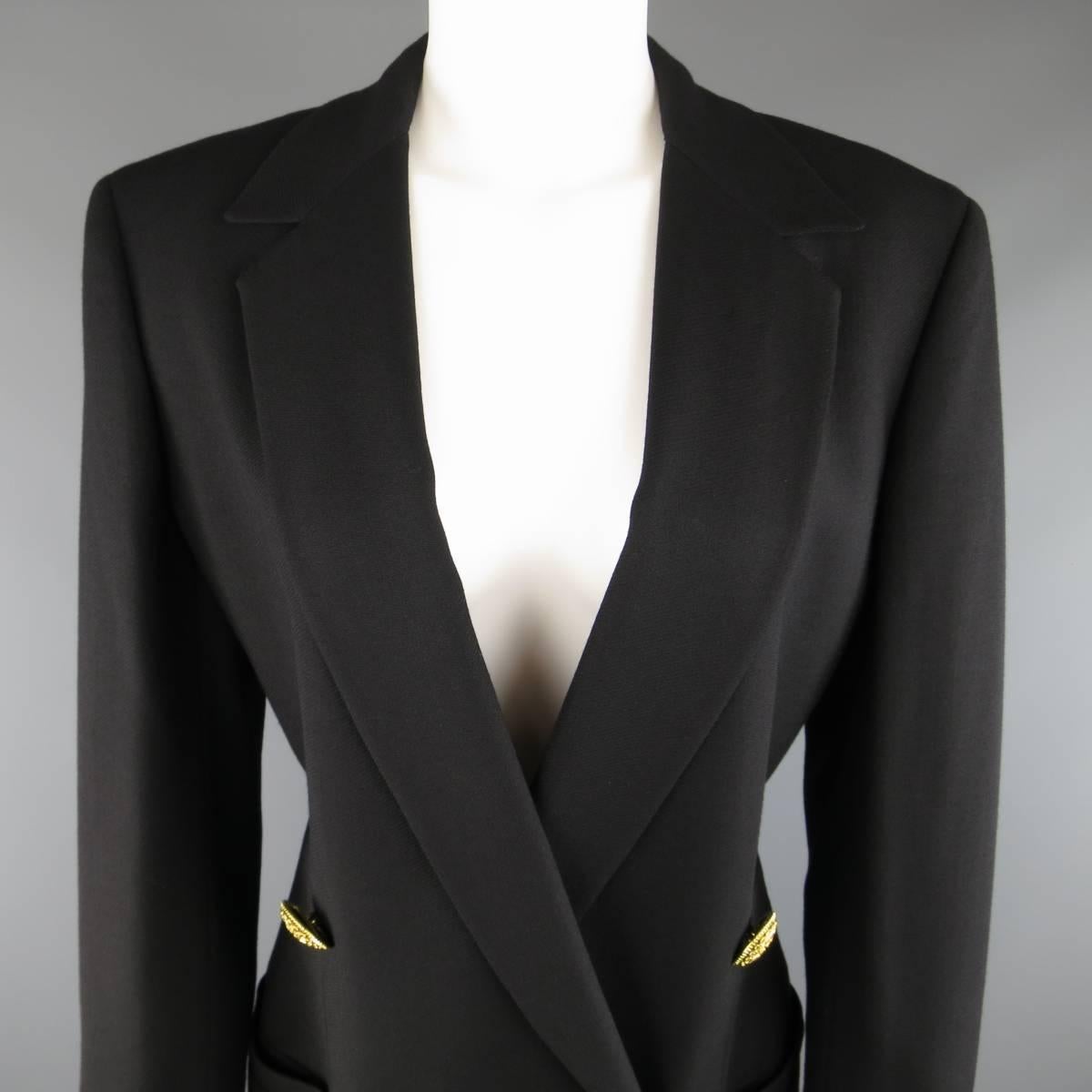 Vintage 1990's GIANNI VERSACE blazer comes in a black wool twill and features a pointed notch lapel, and double breasted closure with oversized, gold tone statement jewelry buttons. Care tags removed. Made in Italy.
 
Good Pre-Owned