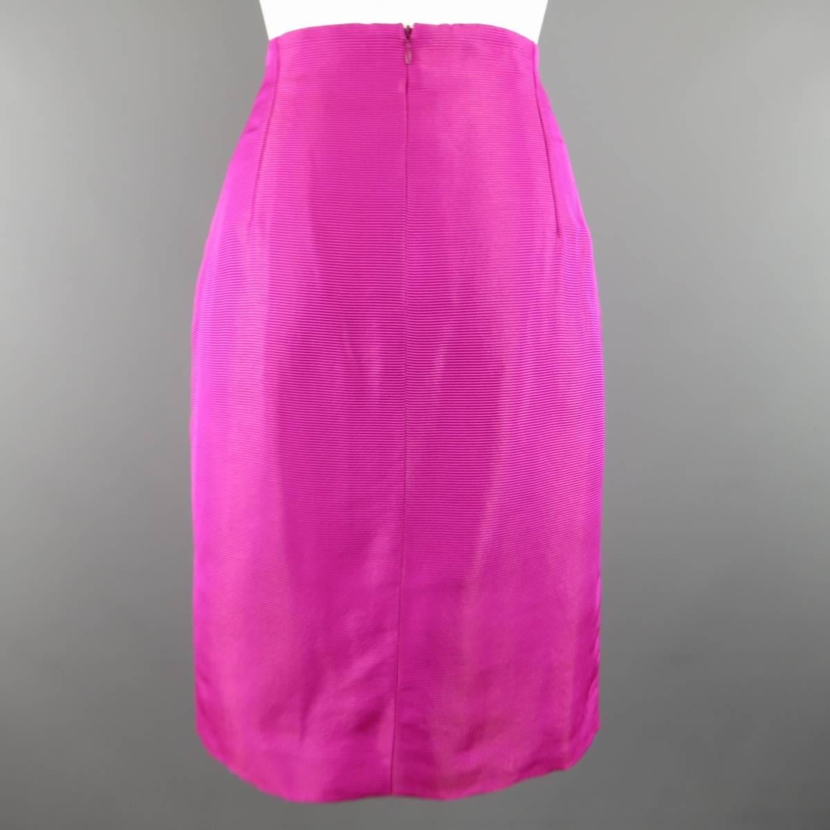 Vintage 1980's GIANNI VERSACE Couture pencil skirt in a brilliant fuchsia pink fabric with sparkly metallic stripes. Small discoloration at back of hem. Made in Italy.
 
Good Pre-Owned Condition.
Marked: 44 / 10
 
Measurements:
 
Waist: 29 in.
Hip: