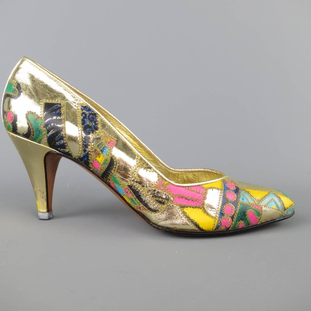 These iconic vintage circa late 1980's GIANNI VERSACE pumps come in a metallic gold leather with asymmetrical, multi-color patchwork VOGUE tribute print. Minor wear and imperfection on heels. As-Is. This archive print was recently brought back for