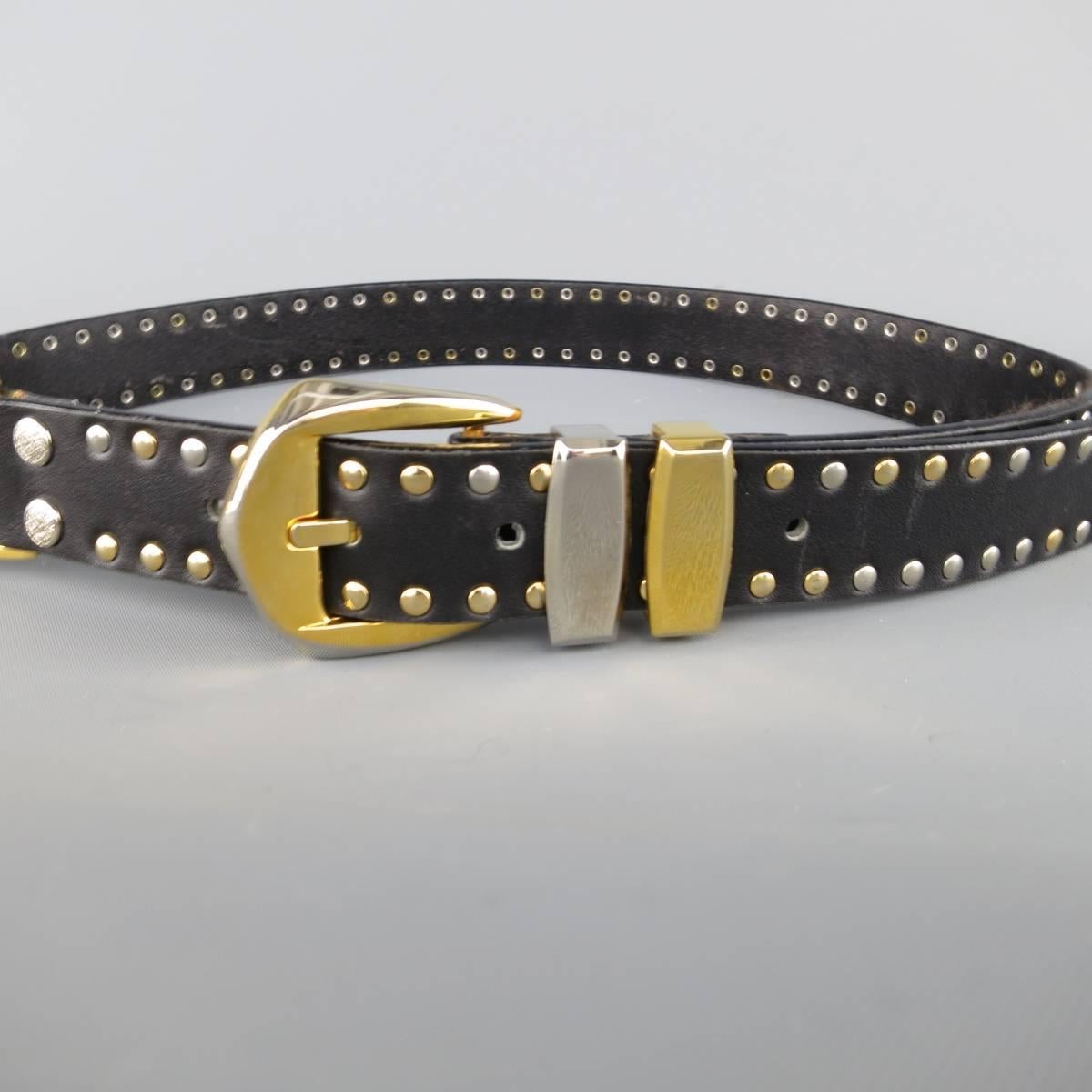 Vintage 1990's GIANNI VERSACE statement belt features a black silver & gold tone studded leather strap with Medusa emblem piece and Western style belt buckle. Made in Italy.
 
Excellent Pre-Owned Condition.
Marked: 75 / 30
 
Length: 37