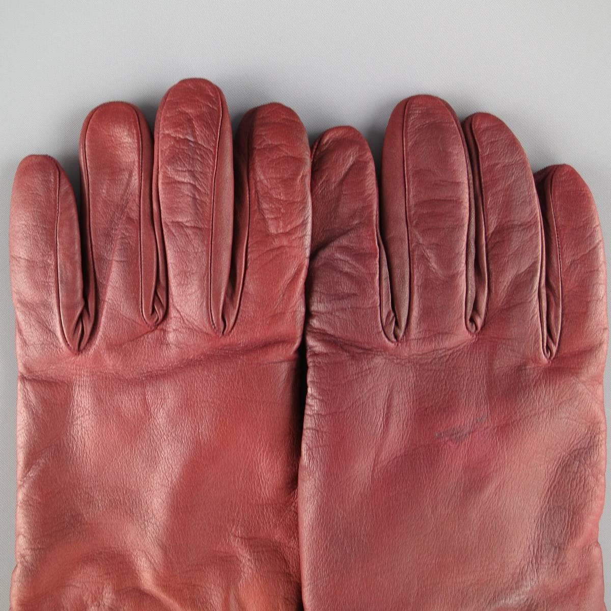 GIORGIO ARMANI gloves come in rich burgundy soft lambskin leather with embossed logo. Heavy wear throughout. includes tags. Made in Italy.
 
Fair Pre-Owned Condition.
Marked: M
 
Length: 8.5 in.
Width: 4.5 in.

SKU: 84641