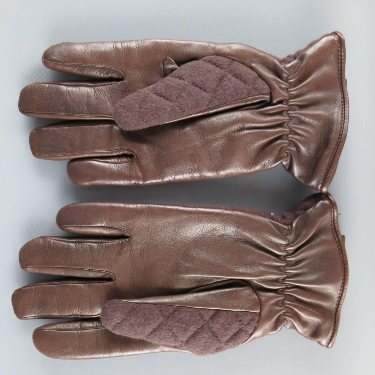 ARMANI COLLEZIONI winter gloves come in a quilted brown wool blend fabric with a lambskin leather palm, elastic cinched wrist, and leather embossed tag. Made in Italy.
 
New with Tags.
 
Length: 9.5 in.
Width: 4 in.

SKU: 84642