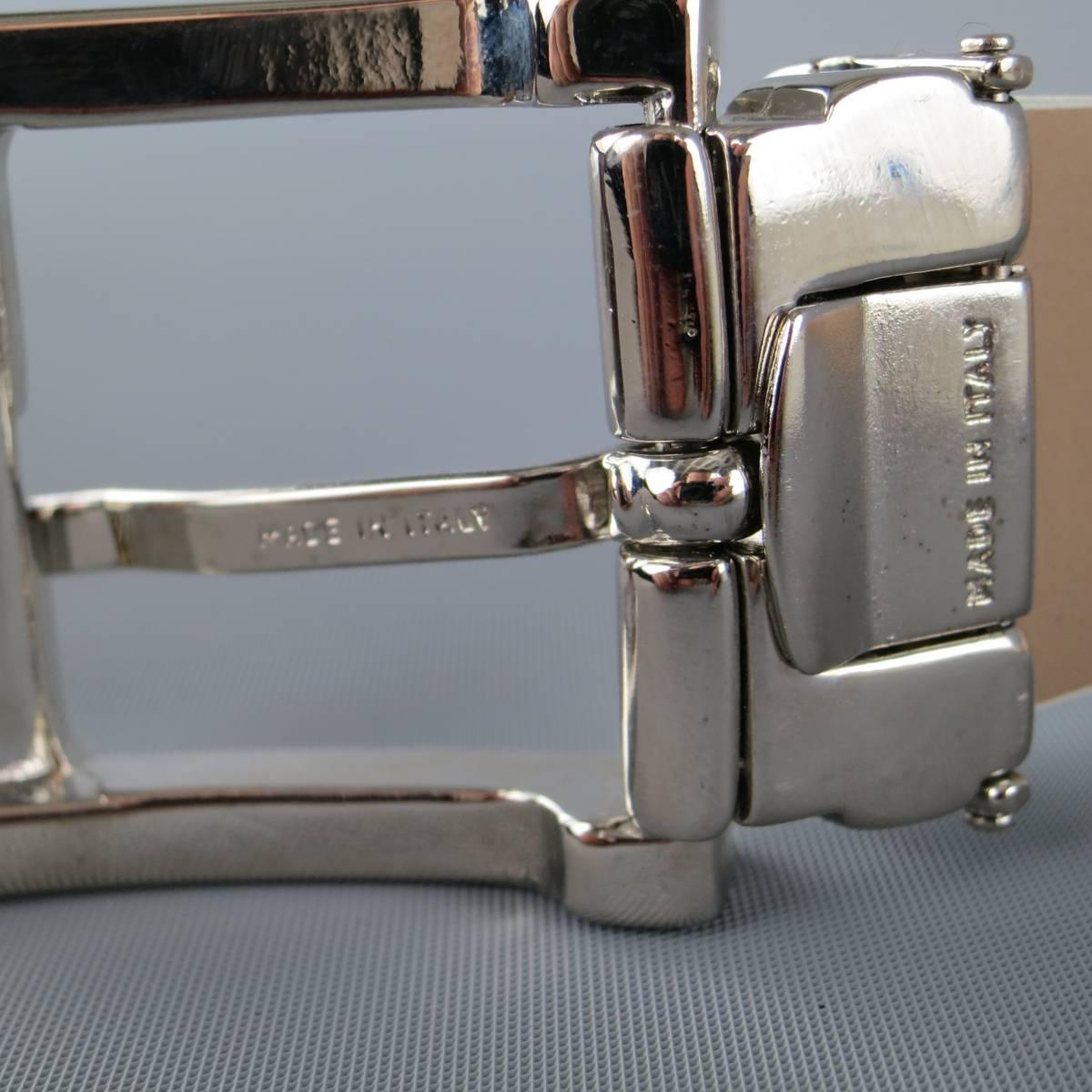 EMPORIO ARMANI dress belt comes in an off white crocodile texture embossed leather with a polished silver tone metal buckle. Wear throughout. As-Is. Made in Italy.
 
Fair Pre-Owned Condition.
Marked: YEMN16
 
Length: 41 in.
Width: 1 in.
Fits: 34.5 -