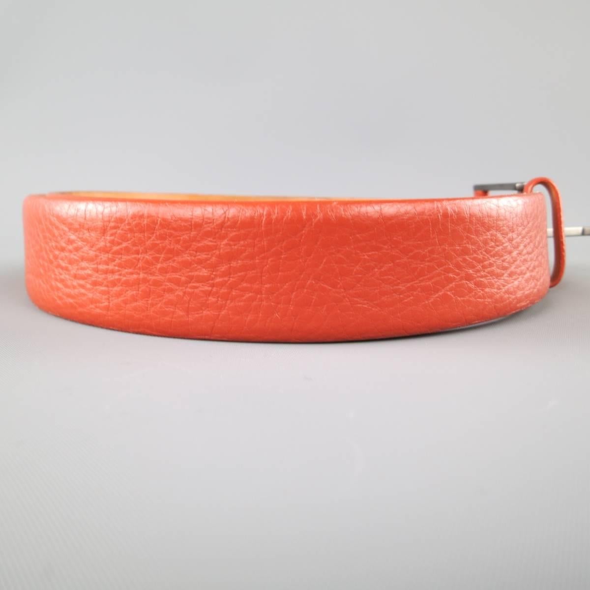 GIORGIO ARMANI dress belt features a rich burnt orange pebbled leather strap with a smoke silver tone, leather detailed, buckle. Made in Italy.
 
Good Pre-Owned Condition.
Marked: 48
 
Length: 38.5 in.
Width: 1.25 in.
Fits: 32-36 in.

SKU: 84647