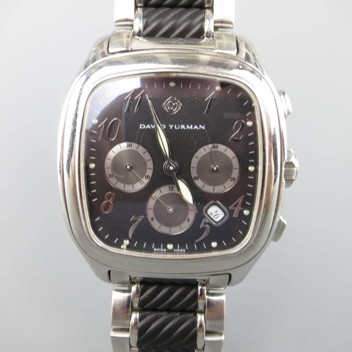 DAVID YURMAN Thoroughbred Chronograph wrist watch comes in polished silver tone stainless steel with black textured accents with a rectangular clock face. Small stud is loose in clock face. Otherwise Excellent Condition. As-Is.
 
Good Pre-Owned