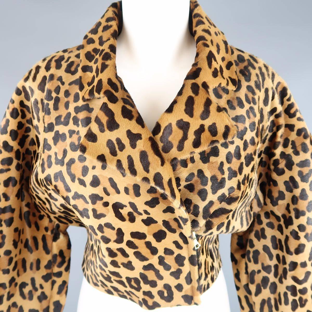 This fabulous ALBERTA FERRETTI jacket comes in a leopard cheetah print calf hair leather and features a double breasted biker jacket style zip front, cropped hem, and wide , cuffed sleeves. Tag removed. Made in Italy.
 
Good Pre-Owned