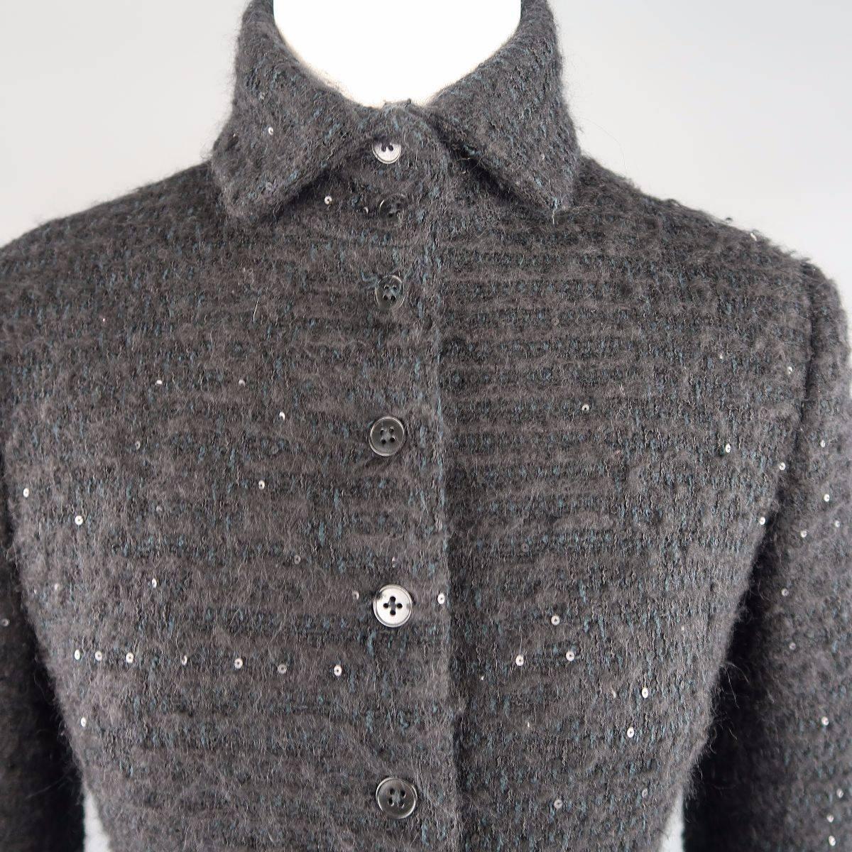 RALPH LAUREN COLLECTION jacket comes in a wool blend sequin textured boucle fabric with dark teal details and features a spread collar and button up front. Made in USA.
 
Good Pre-Owned Condition.
Marked: 10
 
Measurements:
 
Shoulder: 17 in.
Bust: