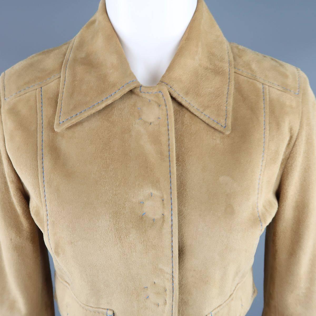 DOLCE & GABBANA retro 1970's style jacket in a tan suede featuring a pointed collar, double patch flap pockets, hidden oversized snap closures, and b;lue contrast stitching throughout. Small imperfection on chest. As-Is. Made in Italy.
 
Good