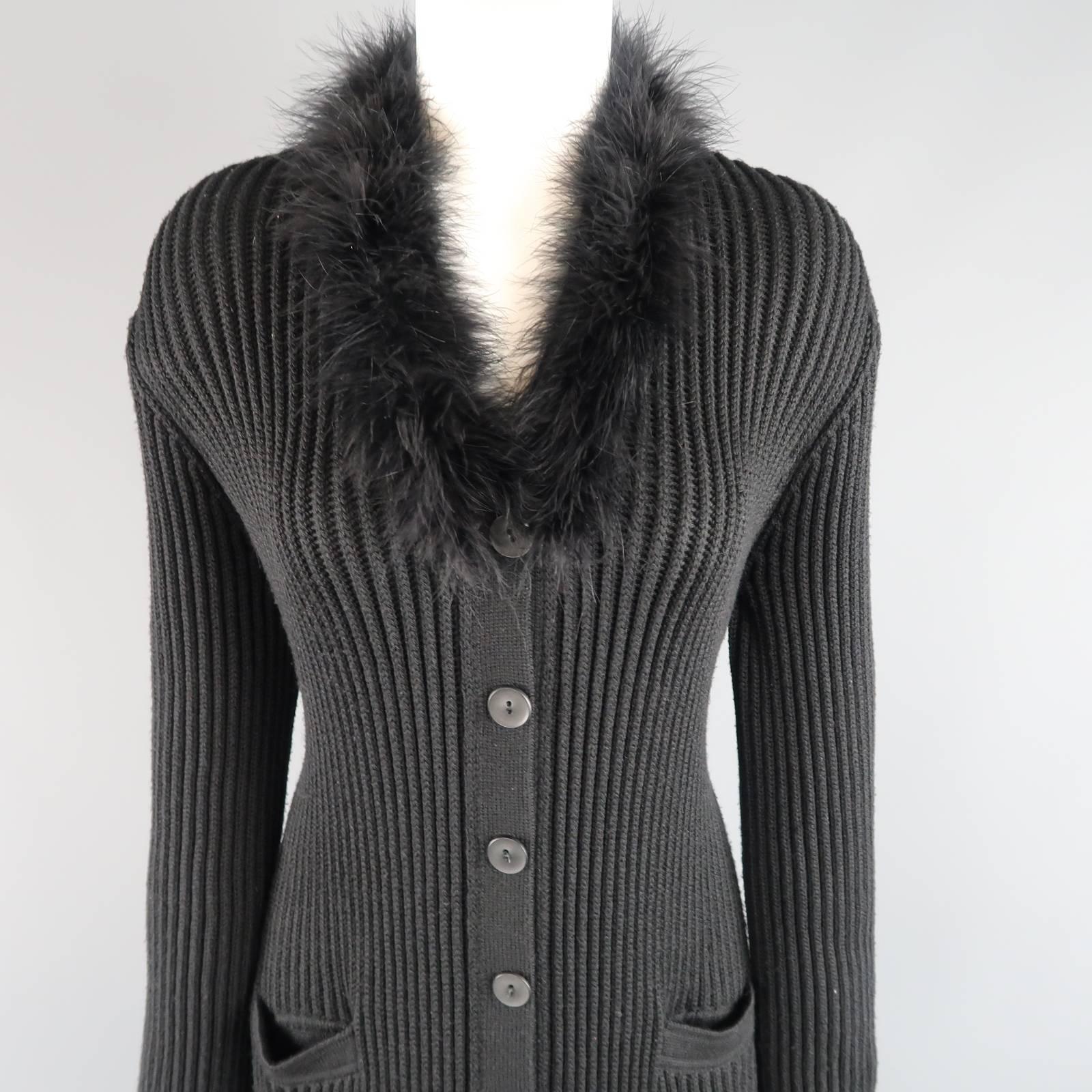 GIORGIO ARMANI extra long cardigan coat comes in a wool silk blend ribbed knit and features a V neckline with feather boa trim. Wear throughout. Made in Italy.
 
Good Pre-Owned Condition.
Marked: IT 44
 
Measurements:
 
Shoulder: 17 in.
Bust: 40