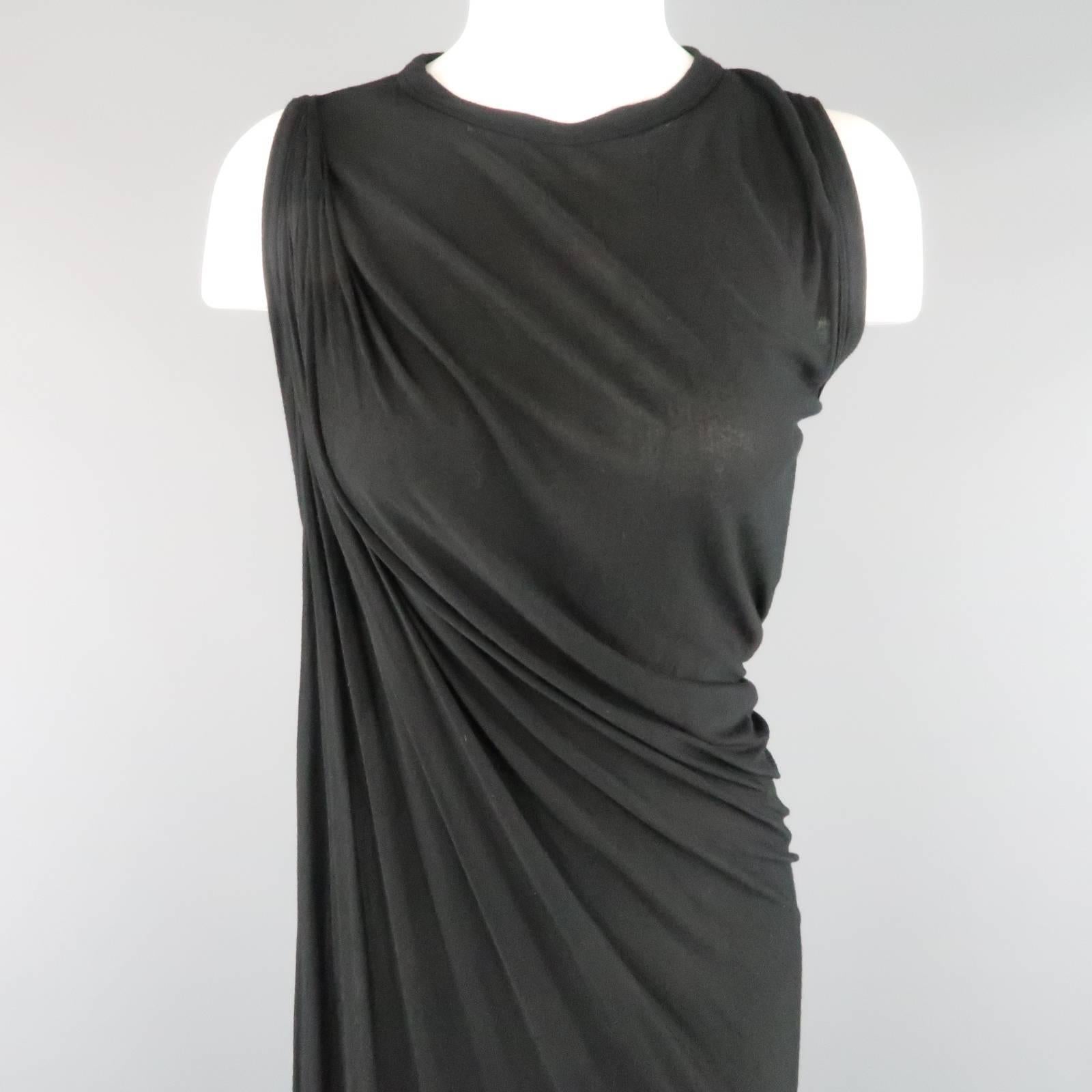 RICK OWENS T-shirt dress comes in a light weight, sheer jersey and features a round neckline, racer back, and asymmetrical draped sheath construction. Small holes. As-Is. Made in Italy.
 
Good Pre-Owned Condition.
Marked: US 10
 
Measurements:
