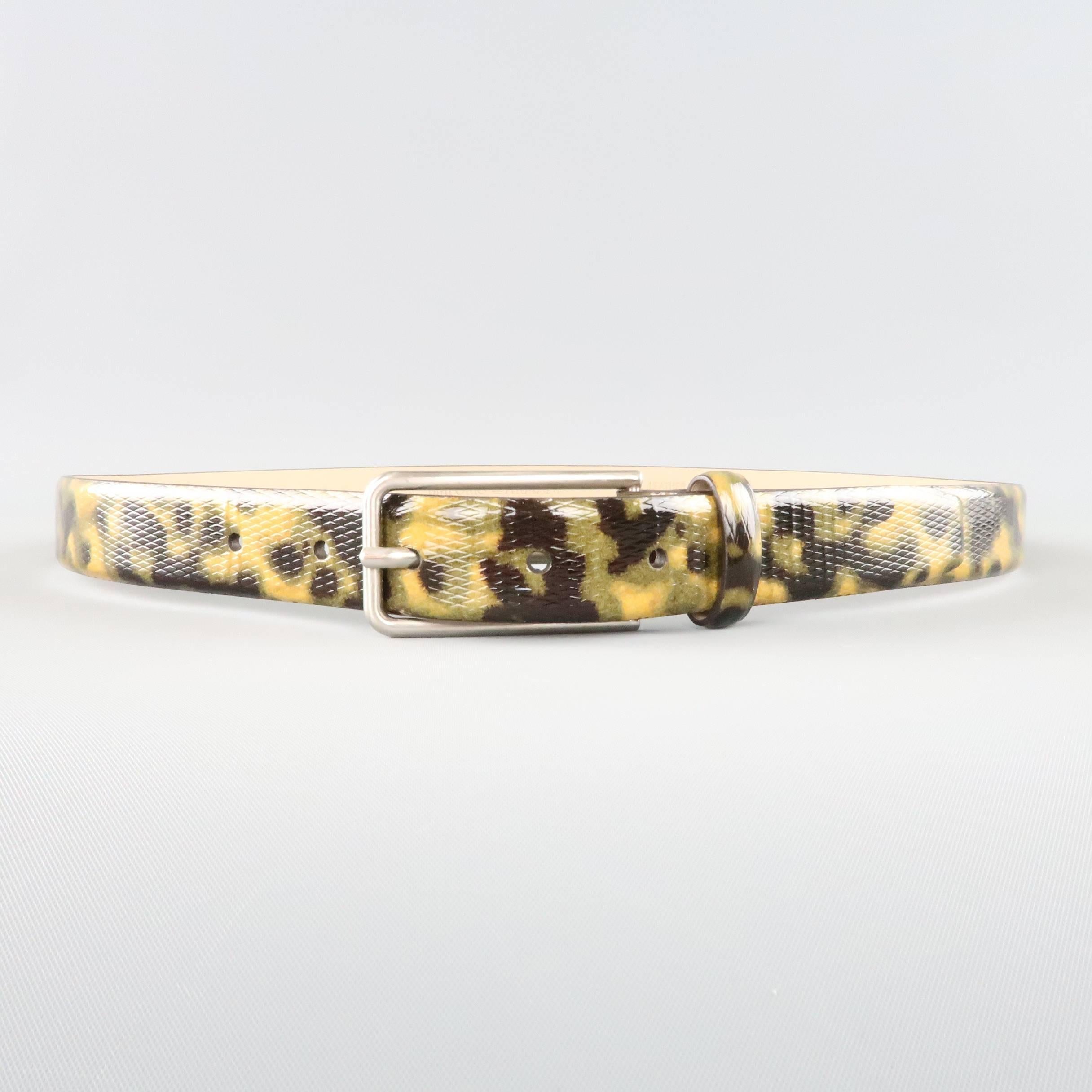 EMPORIO ARMANI dress belt comes in a unique camouflage tortoiseshell print textured patent leather with a sleek skinny silver tone buckle. Made in Italy.
 
Excellent Pre-Owned Condition.
Marked: 48
 
Length: 39 in.
Width: 1 in.
Fits: 32-36 in.

SKU: