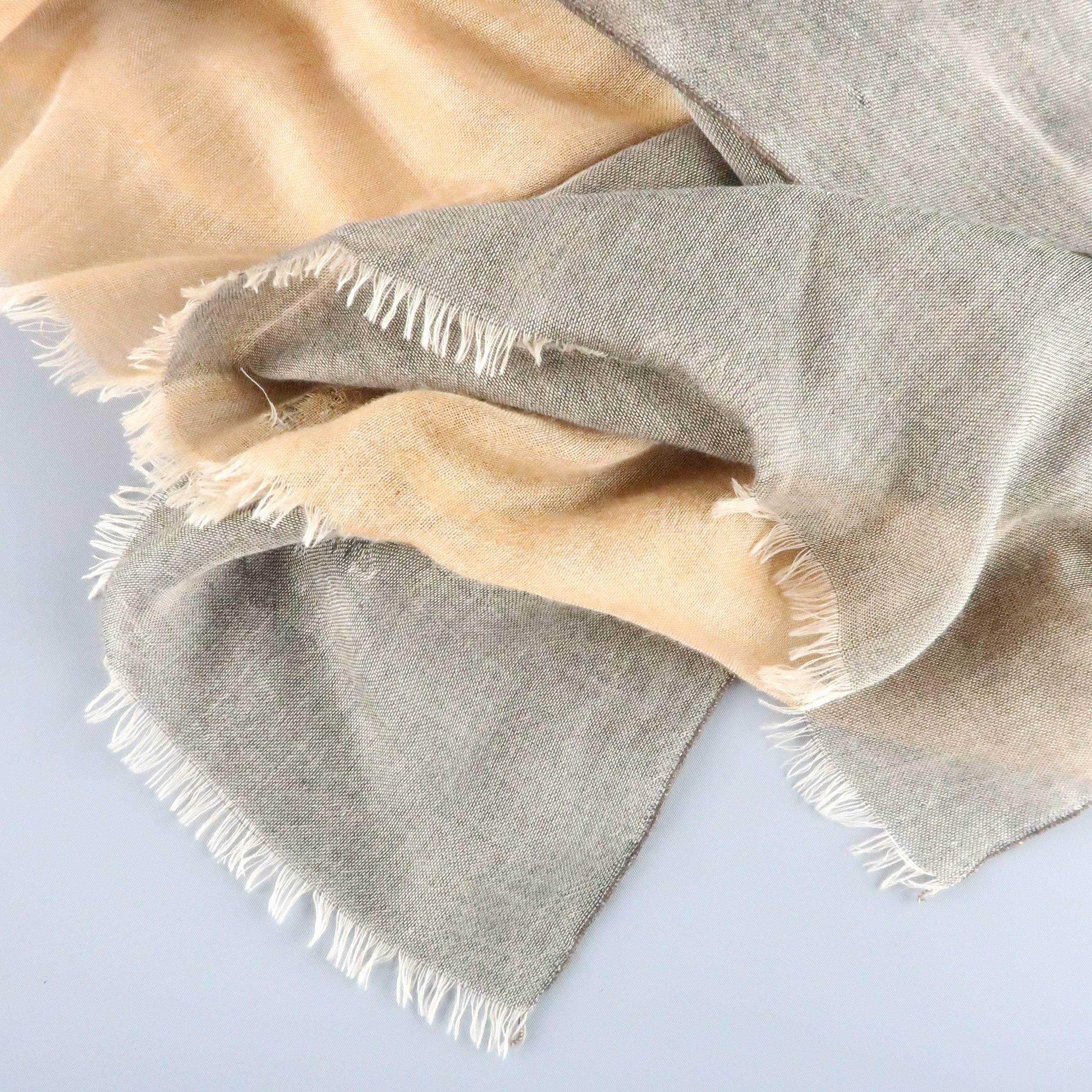 Light weight ETRO scarf comes in gold and taupe gray cashmere silk blend sheer gauze, layered with a seam down the center with frayed edges. Wear throughout. As-Is. Made in Italy.
 
Fair Pre-Owned Condition.
 
81 x 29 in.

SKU: 83018