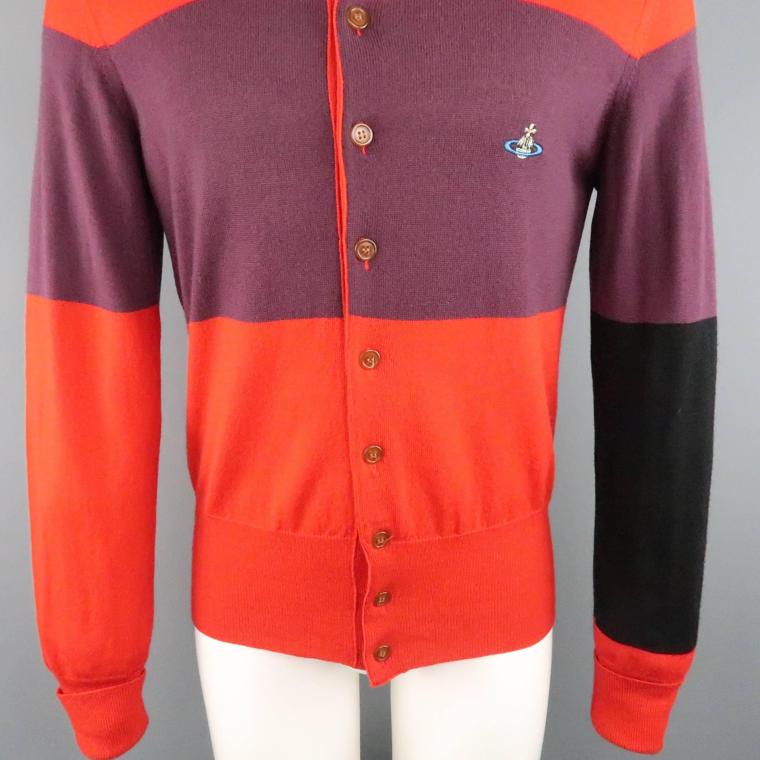 VIVIENNE WESTWOOD MAN cardigan comes in a bold red wool with color block purple and navy stripe pattern featuring an embroidered orb logo and cuffed sleeves. Imperfection on cuff. As-Is. Made in Italy.
 
Good Pre-Owned Condition.
Marked: S
