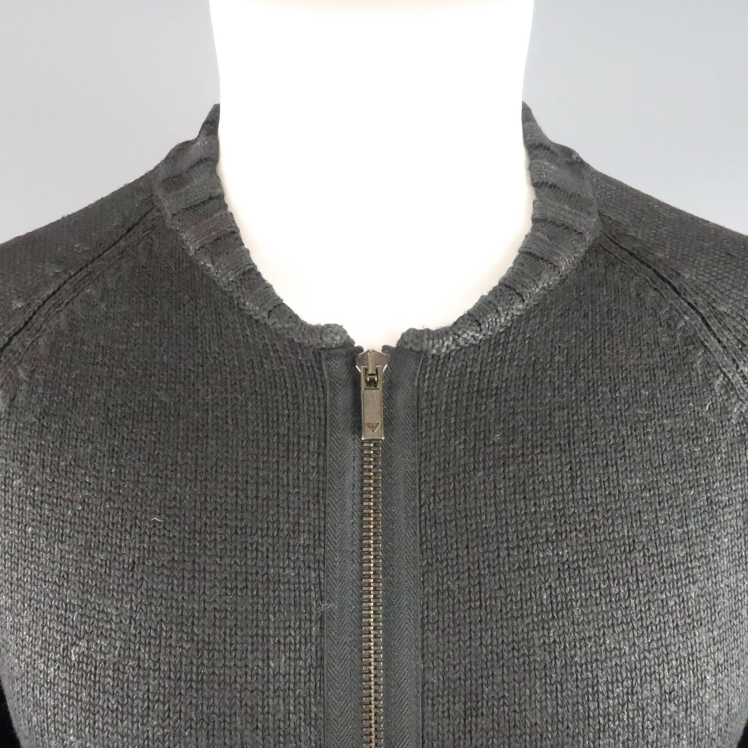 EMPORIO ARMANI zip cardigan sweater comes in a matte shine waxed wool knit and features a baseball collar and ribbed cuffs. Made in Italy.
 
Excellent Pre-Owned Condition.
Marked: IT 46
 
Measurements:
 
Shoulder: 16 in.
Chest: 42 in.
Sleeve: 27