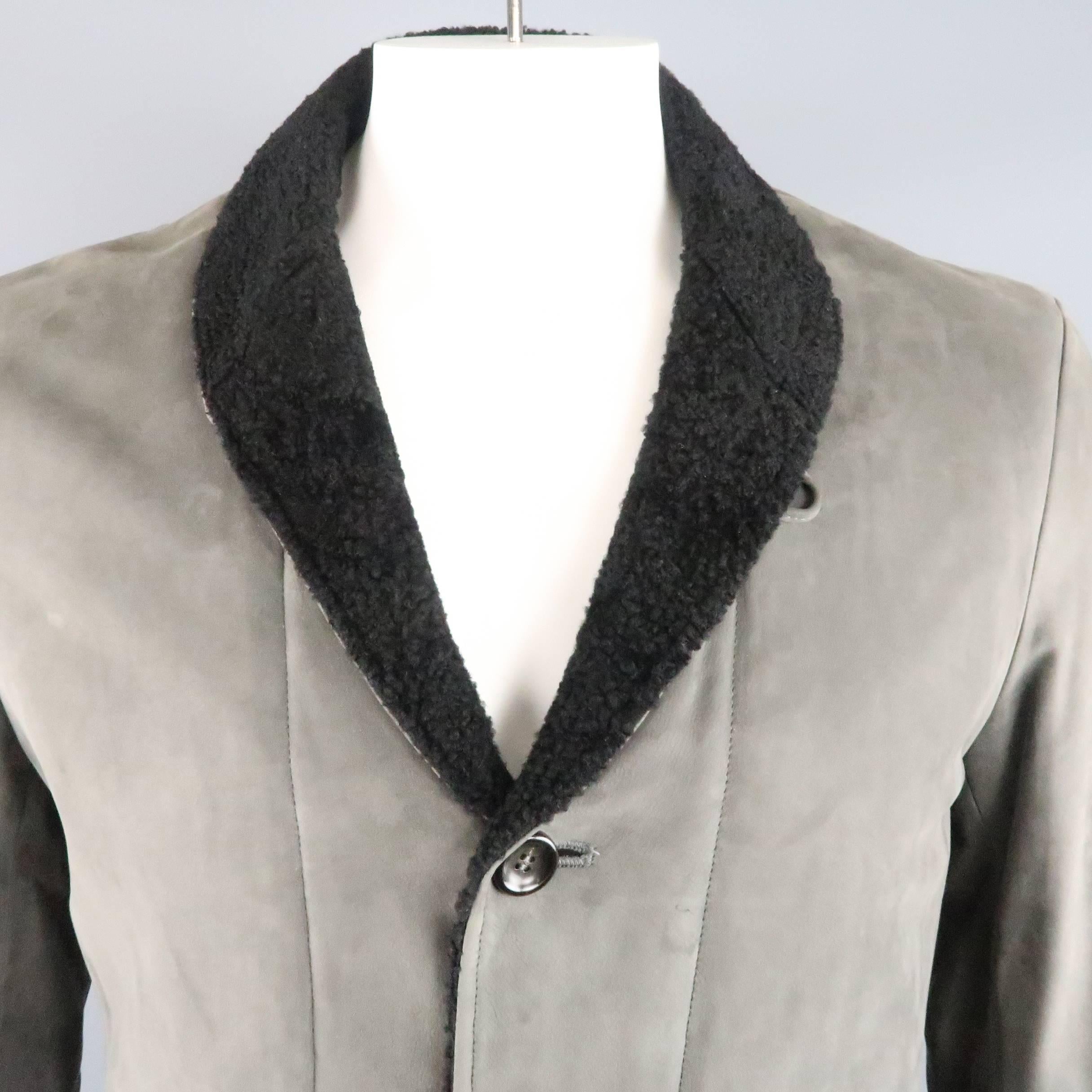 ARMANI COLEZZIONI jacket comes in a soft slate gray suede nubuck calfskin leather and features a black shearling shawl collar, three button front, and fabric liner. Small mark at chest.
 
Good Pre-Owned Condition.
Marked: IT 40
 
Measurements:
