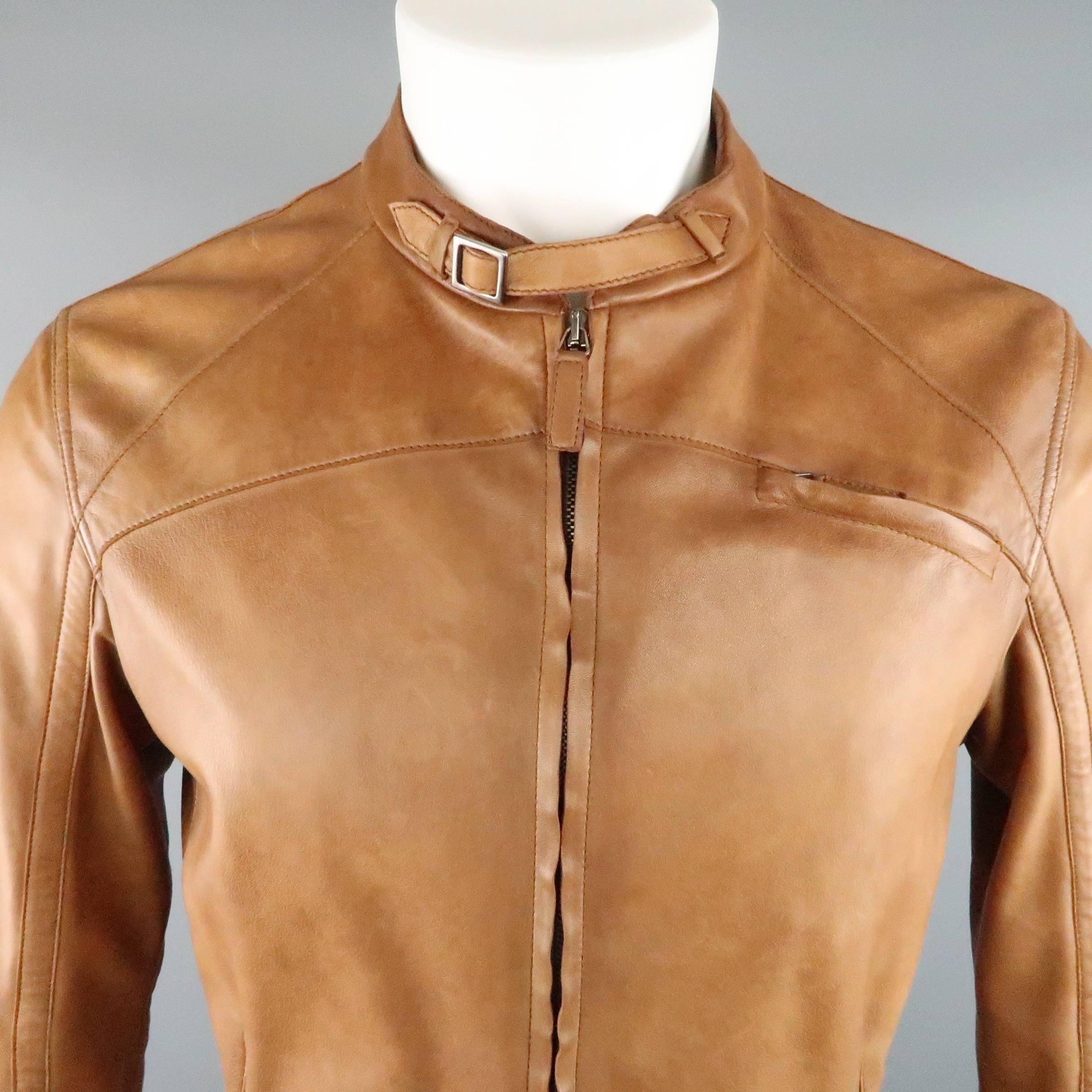 EMPORIO ARMANI biker jacket comes in tan distressed leather and features a belted band collar, zip chest pocket, double zip front, and belted cuffs.
 
Good Pre-Owned Condition.
Marked: IT 50
 
Measurements:
 
Shoulder: 18 in.
Chest: 42 in.
Sleeve: