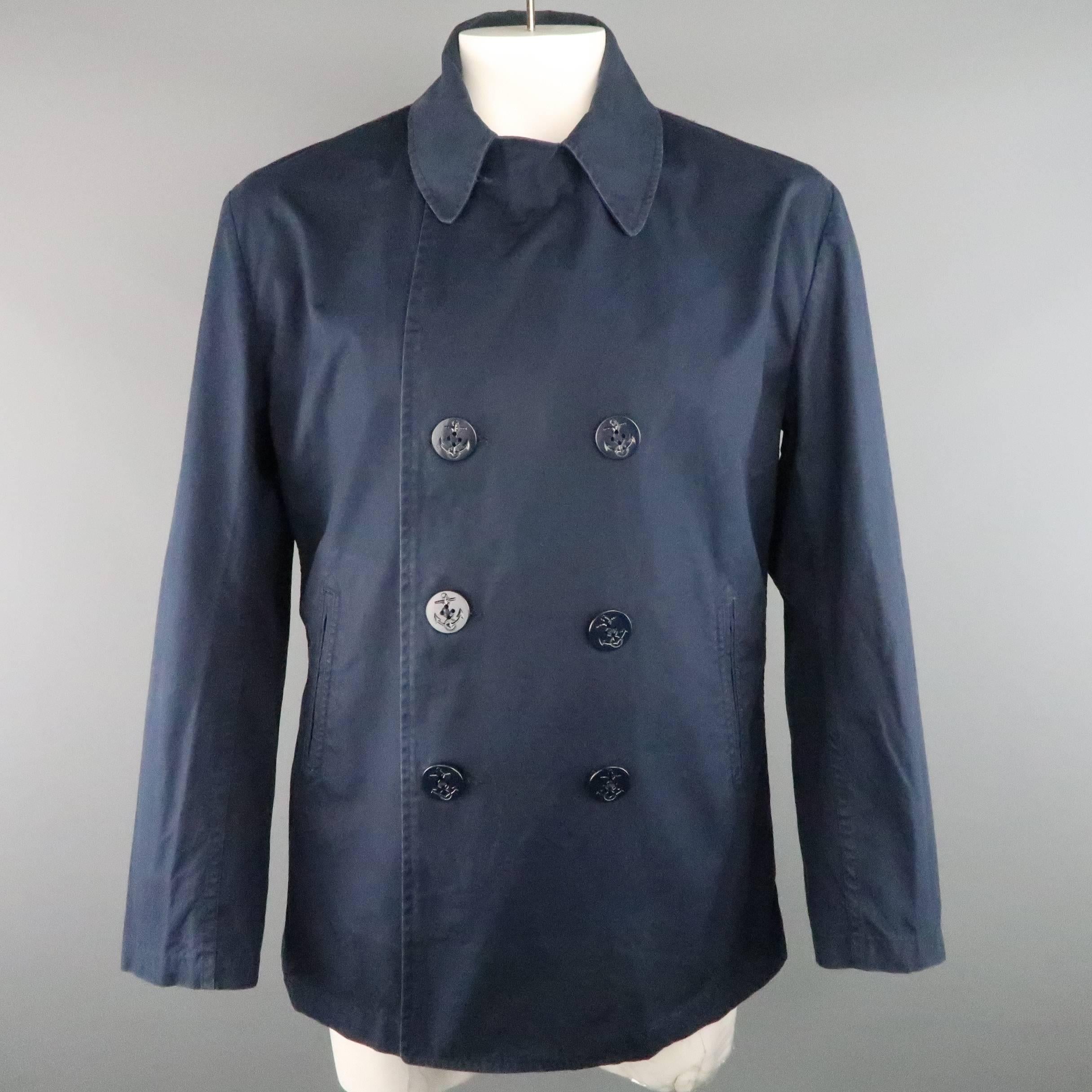 JUNYA WATANABE MAN COMME des GARCONS peacoat  comes in light weight navy blue cotton and features a classic pointed lapel, double breasted front with nautical anchor buttons, and slit pockets. Wear throughout. Made in Japan.
 
Fair Pre-Owned