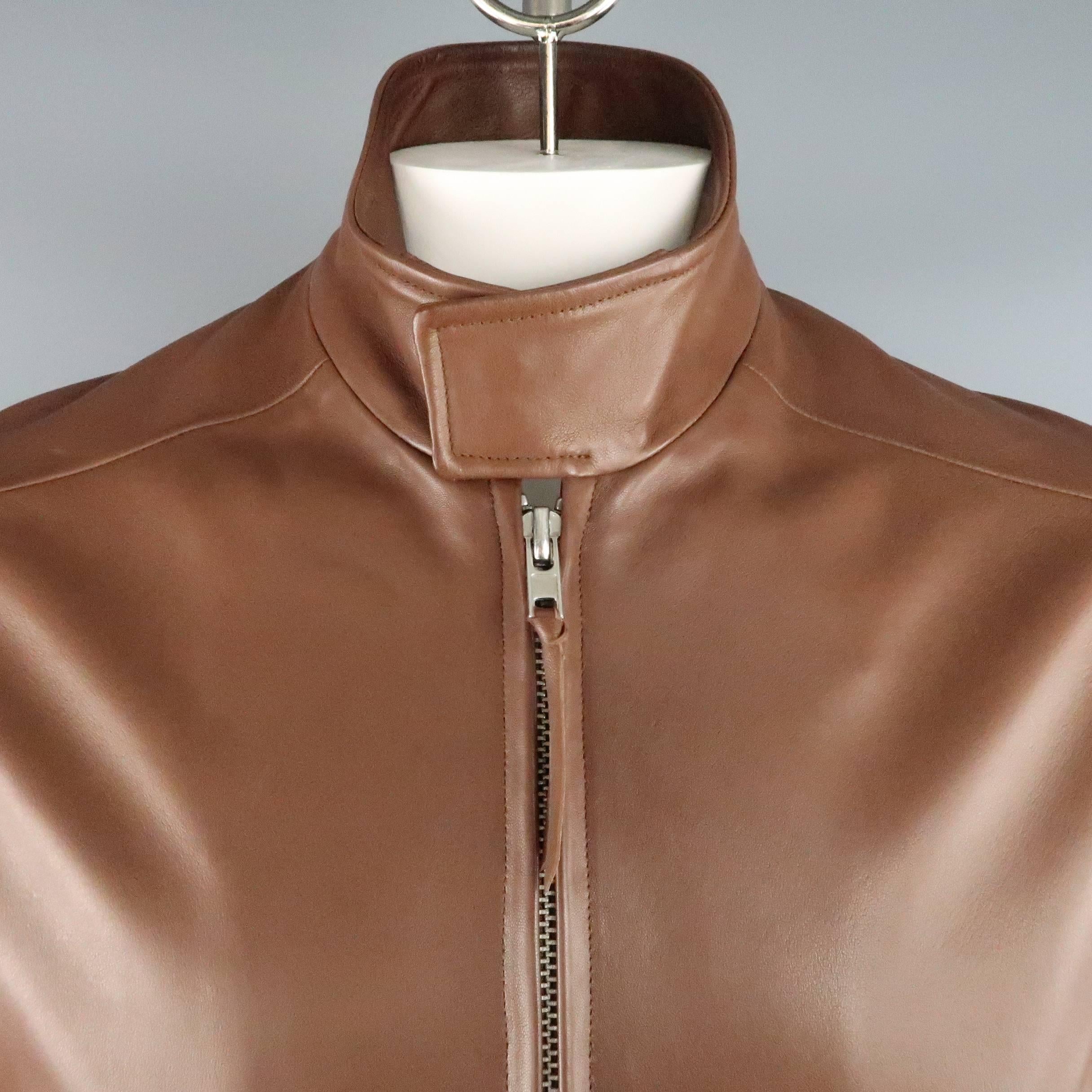 GOLDEN BEAR bomber jacket comes in light brown smooth leather and features a high snap over collar, double zip front, snap cuffs, and hidden snap flap pockets. Some spots throughout leather.. Made in USA.
 
Good Pre-Owned Condition.
Marked: M
