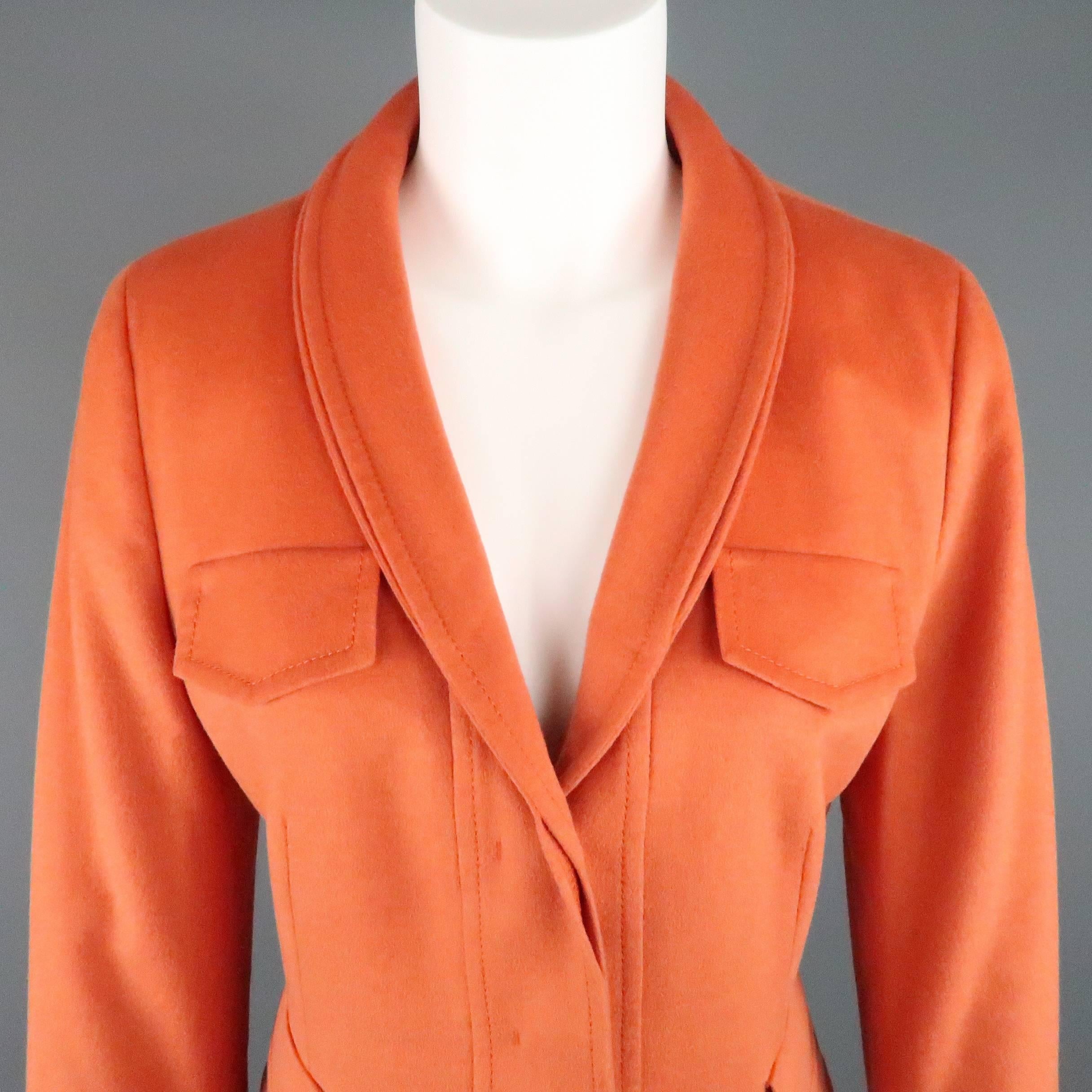 AKRIS jacket comes in a soft orange wool angora bland fabric and features a stacked shawl collar, hidden placket three button closure, faux flap breast pockets, and flap patch pockets. Small spot at hem. As-Is.
 
Good Pre-Owned Condition.
Marked: 8
