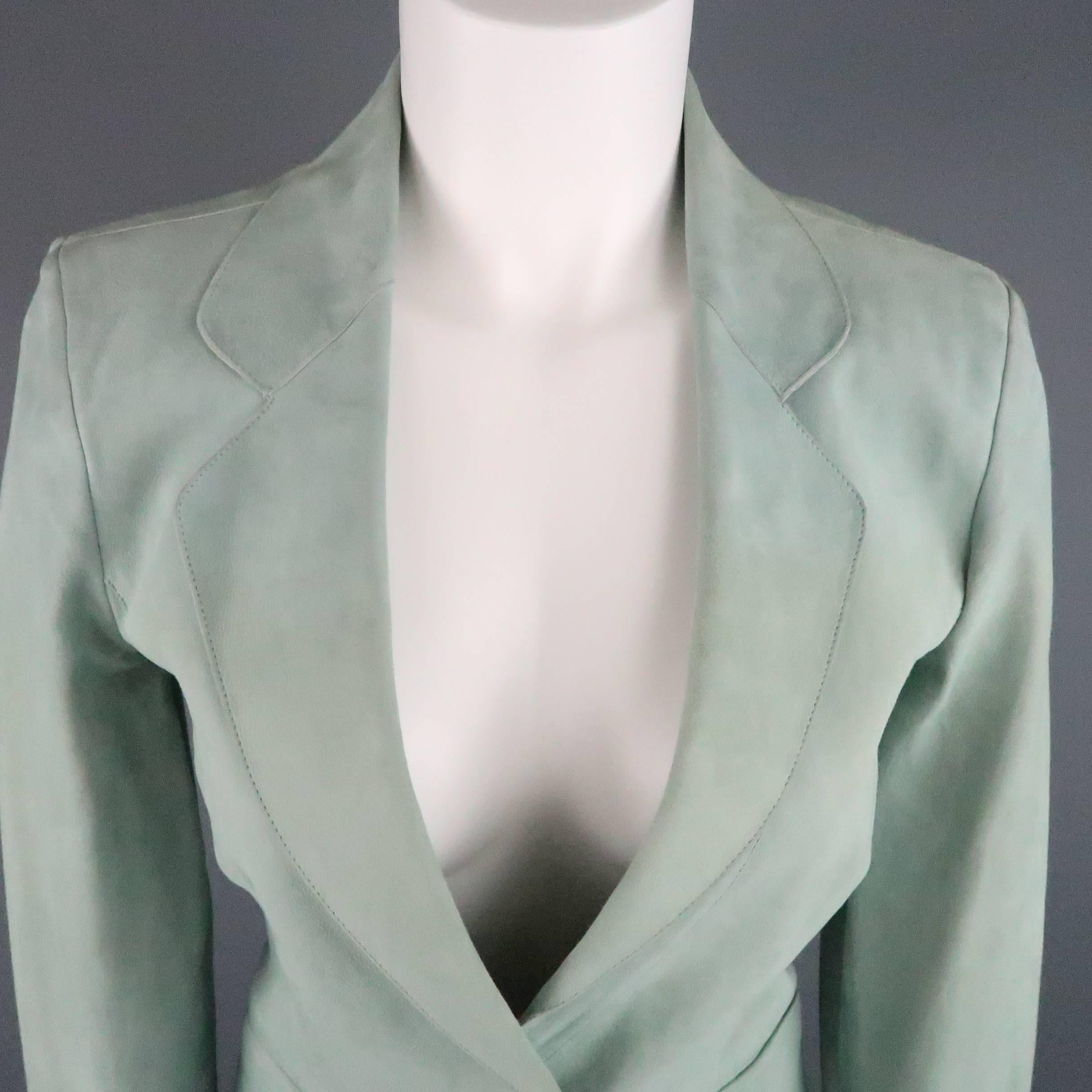 GIORGIO ARMANI cropped sport coat comes in soft cool green nubuck leather and features a round notch lapel, single button closure, and single vented back. Minor fading throughout. As-Is. Made in  Italy.
 
Good Pre-Owned Condition.
Marked: IT 42
