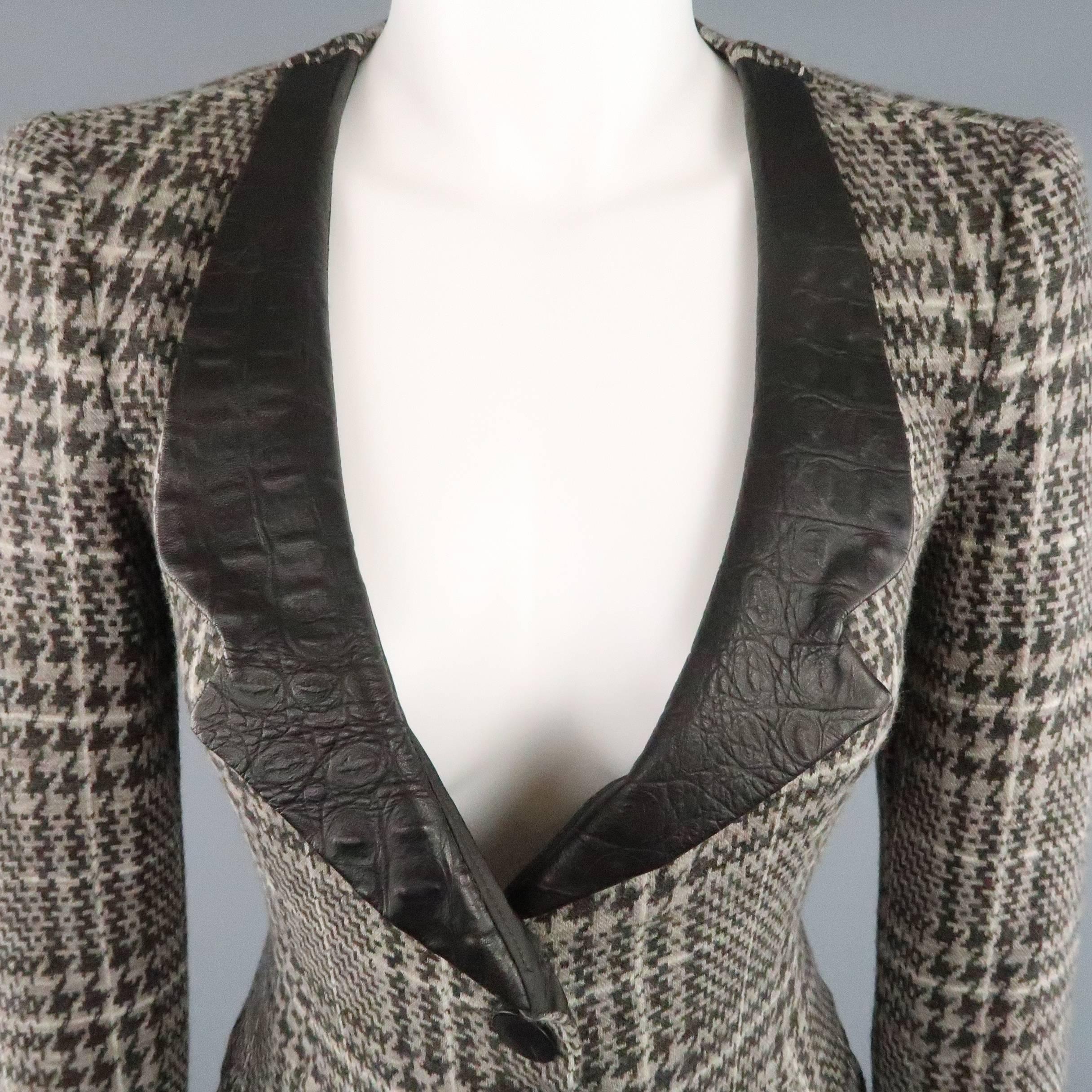 ARMANI COLLEZIONI jacket comes in a taupe gray houndstooth print wool and features a six button front and crocodile embossed lapel and cuffs. Made in Italy.
 
Excellent Pre-Owned Condition.
Marked: 6
 
Measurements:
 
Shoulder: 15 in.
Bust: 35